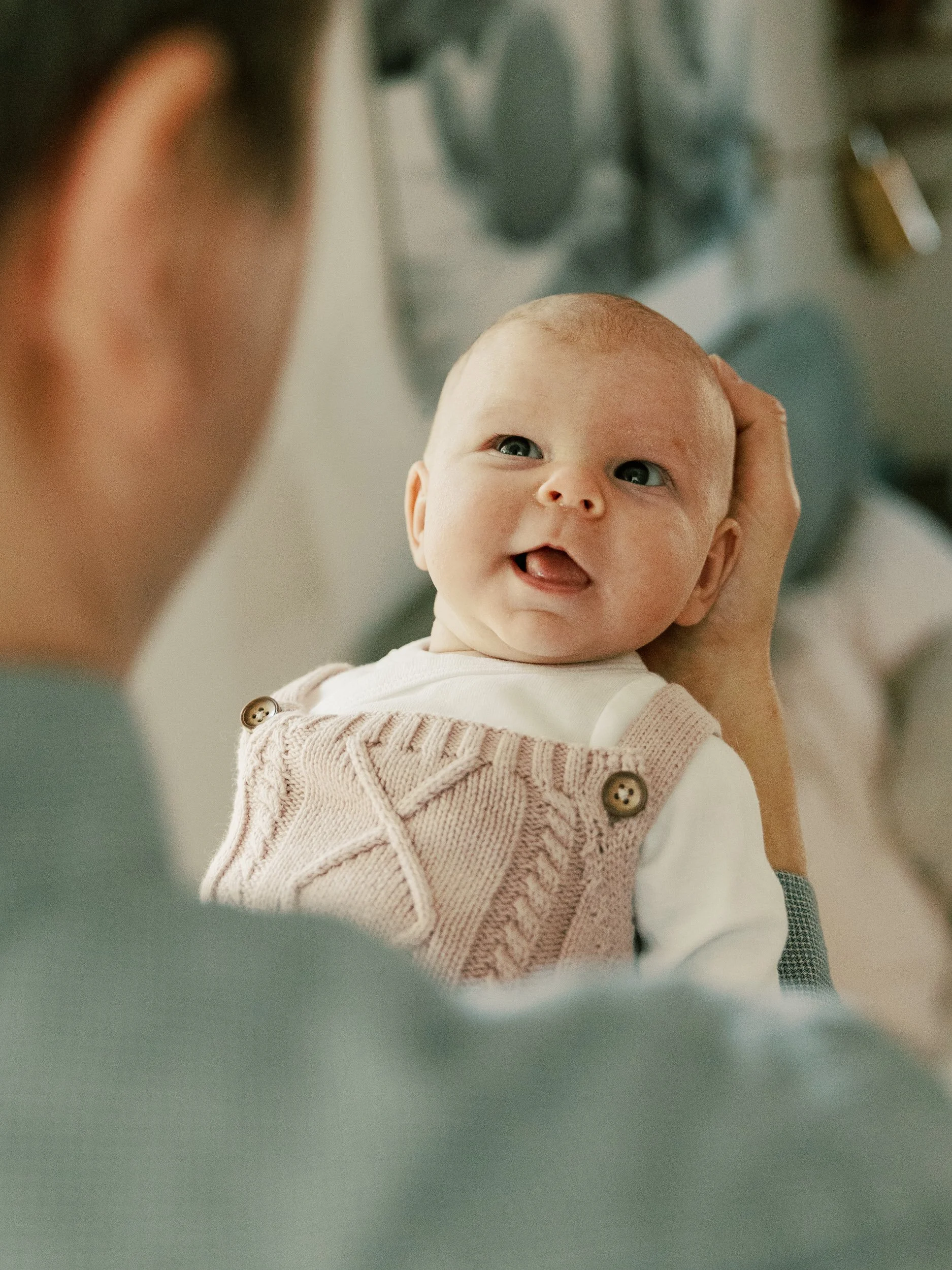 Quiet moment with newborn baby and dad at home