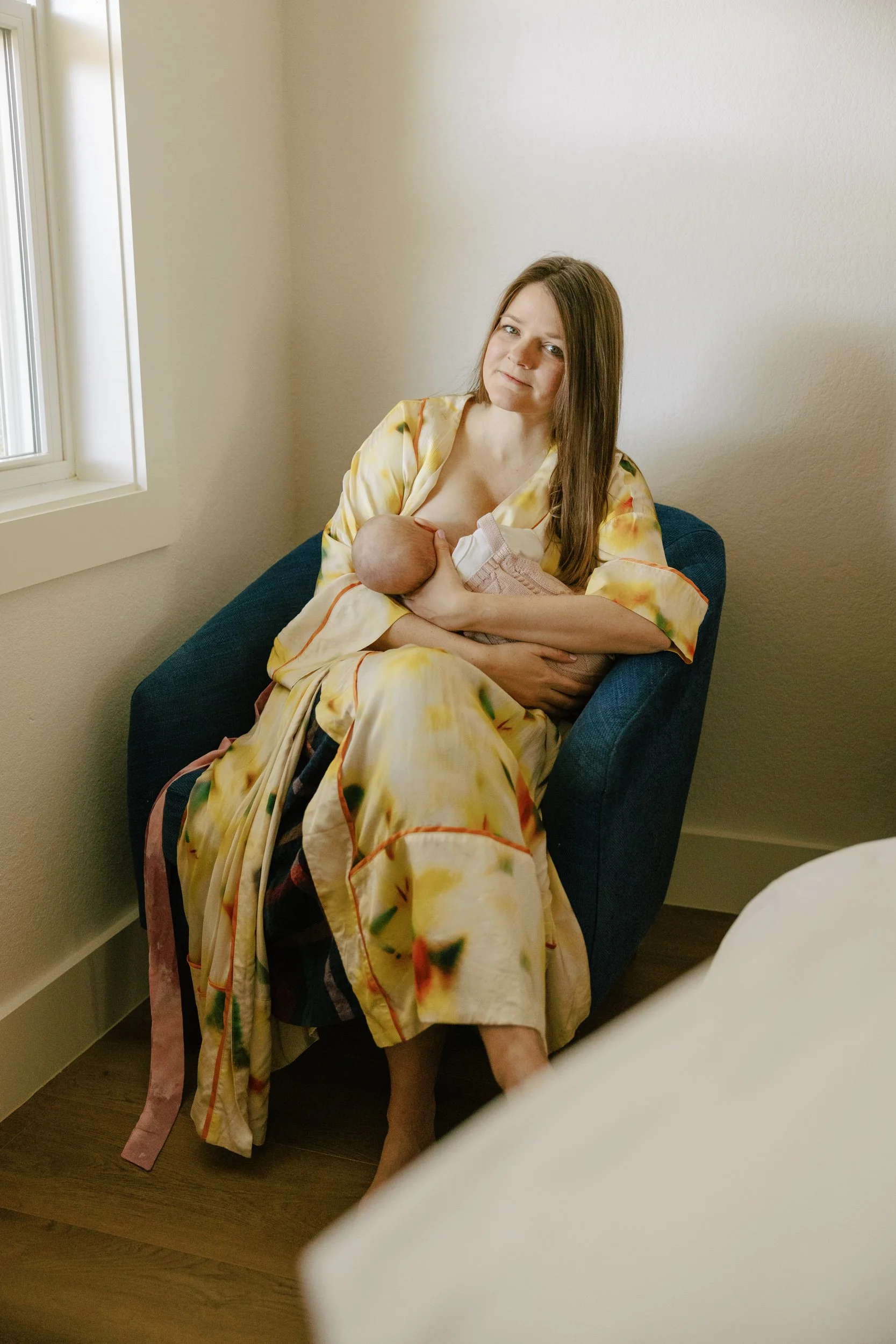 Mom nursing baby during seattle family photography session