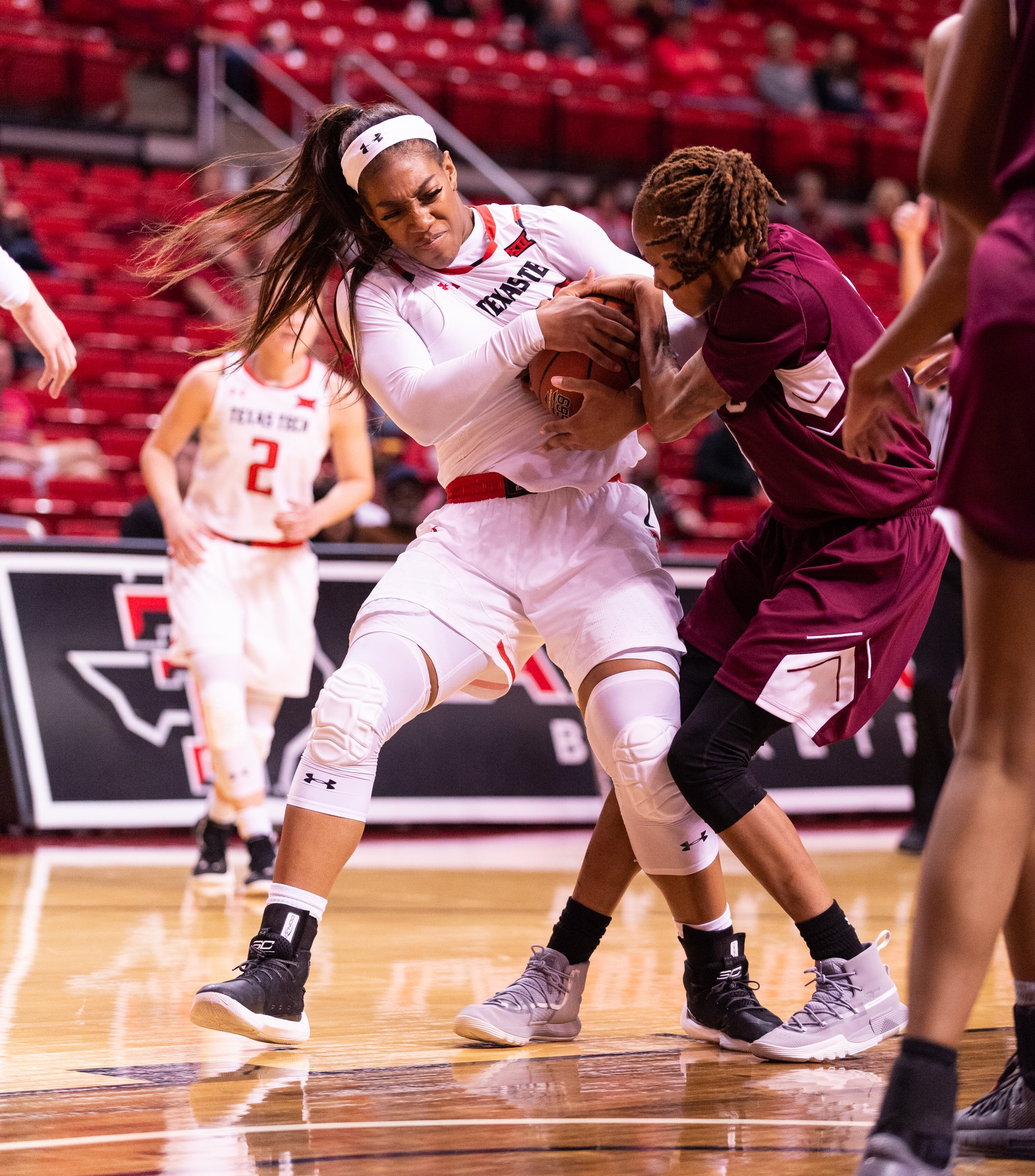  Texas Tech's Zuri Sanders (30) wrestles for the ball with Texas Southern's Niya Mitchell (2) during the game Saturday, Dec. 22, 2018 at the United Supermarkets Arena in Lubbock, Texas. [Abbie Burnett/A-J Media] 