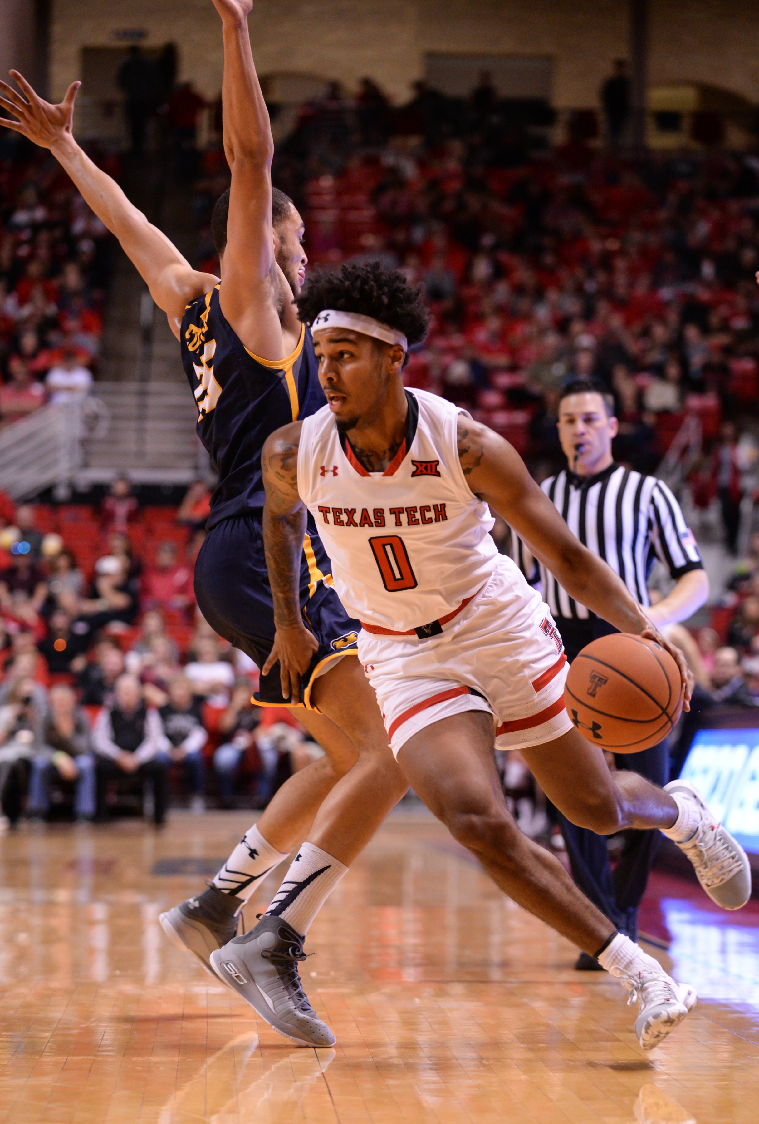 Texas Tech's Kyler Edwards (0) dribbles around UNC's Kai Edwards (25) during the game Saturday, Nov. 24, 2018 at United Supermarkets Arena in Lubbock, Texas. [Abbie Burnett/A-J Media] 