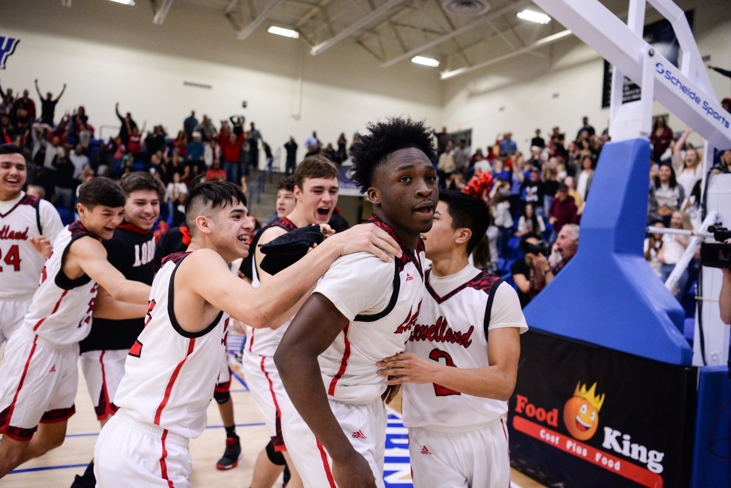  The Levelland team storms the court and teammate Jakeevian Ford (4) after he scored the buzzer-beater shot to win the Region 1 4A regional semifinal game 48-46 against Graham Tuesday, March 1, 2019 at Rip Griffin Center in Lubbock, TX. Levelland wil