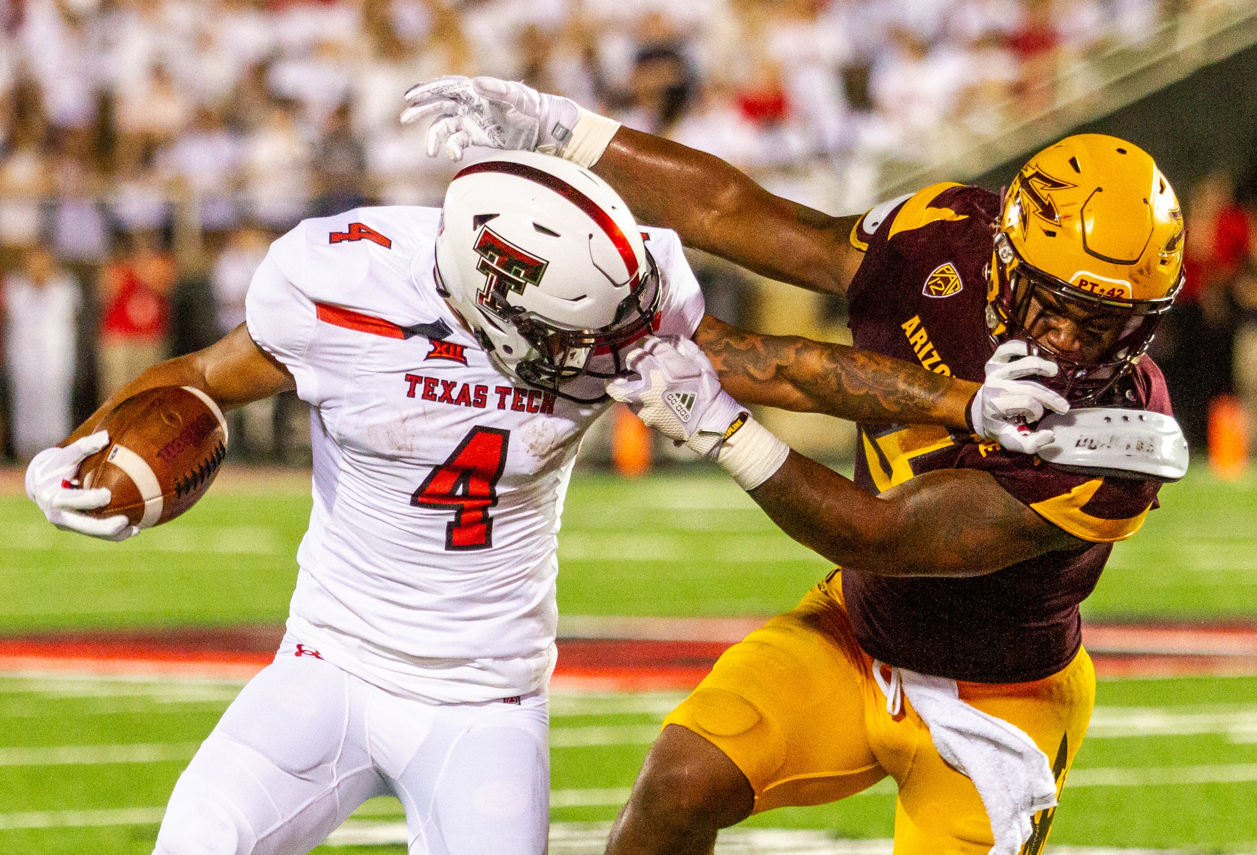  Texas Tech senior running back Justin Stockton tries to defend the ball while being grabbed by the face mask during Tech's game against Arizona State on Saturday, Sept. 17, 2017, at Jones AT&T Stadium. The Red Raiders beat the Sun Devils, 52-45. 