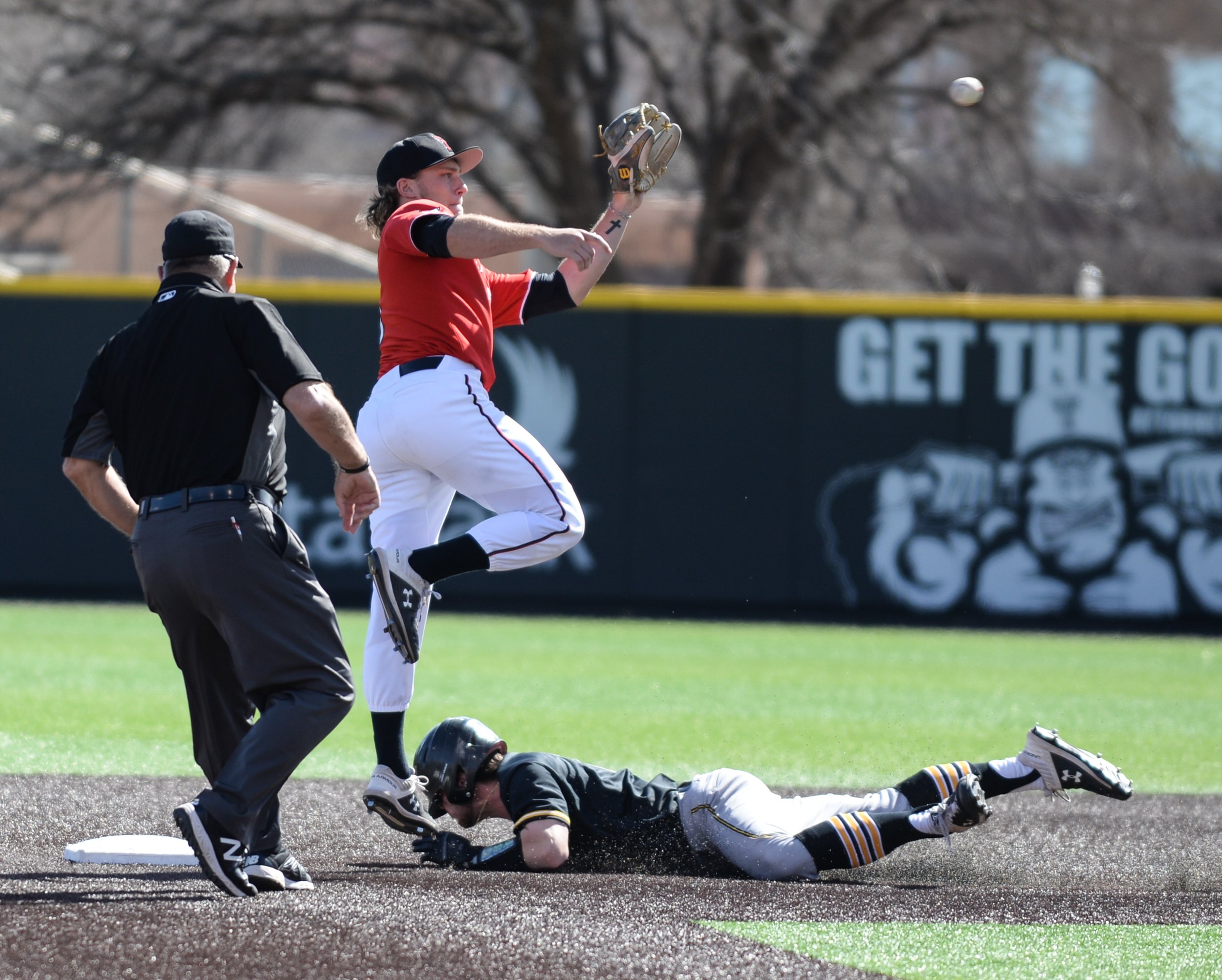  Wichita State's Jack Sigrist (6) safely slides into second base before Texas Tech's Dru Baker (4) can catch the ball during the second series game of three Saturday, March 9, 2019 at Dan Law Field in Rip Griffin Park. [Abbie Burnett/A-J Media] 