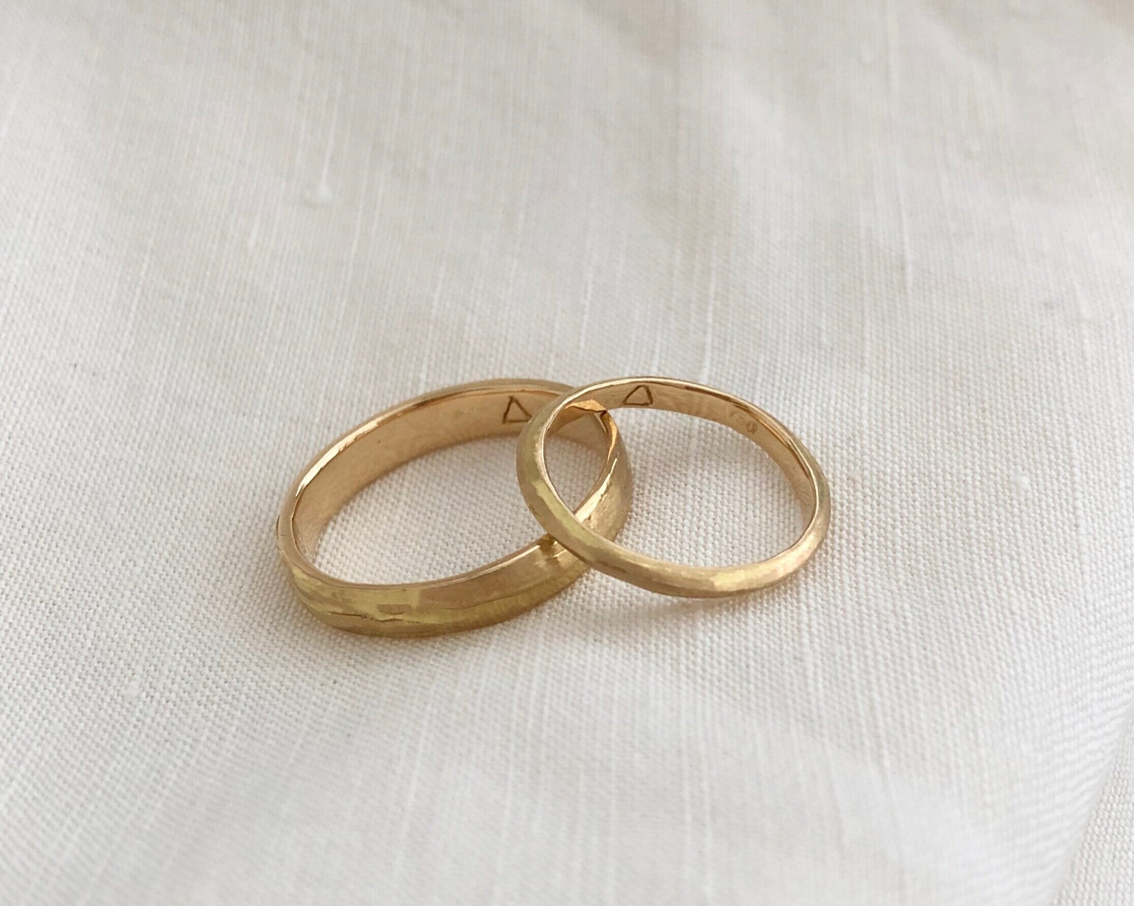  18k yellow gold textured wedding bands with engraving 