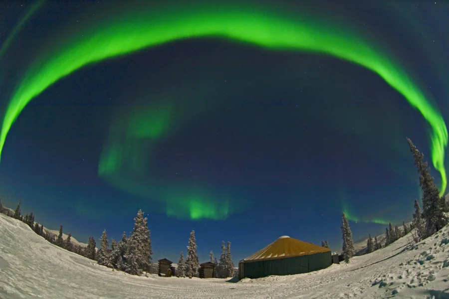 Arched Aurora over Yurt photo by McClean Image Studio