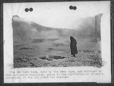 Man looking at healing water pools
