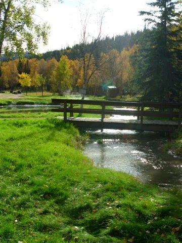 Autumn colors walking bridge over creek