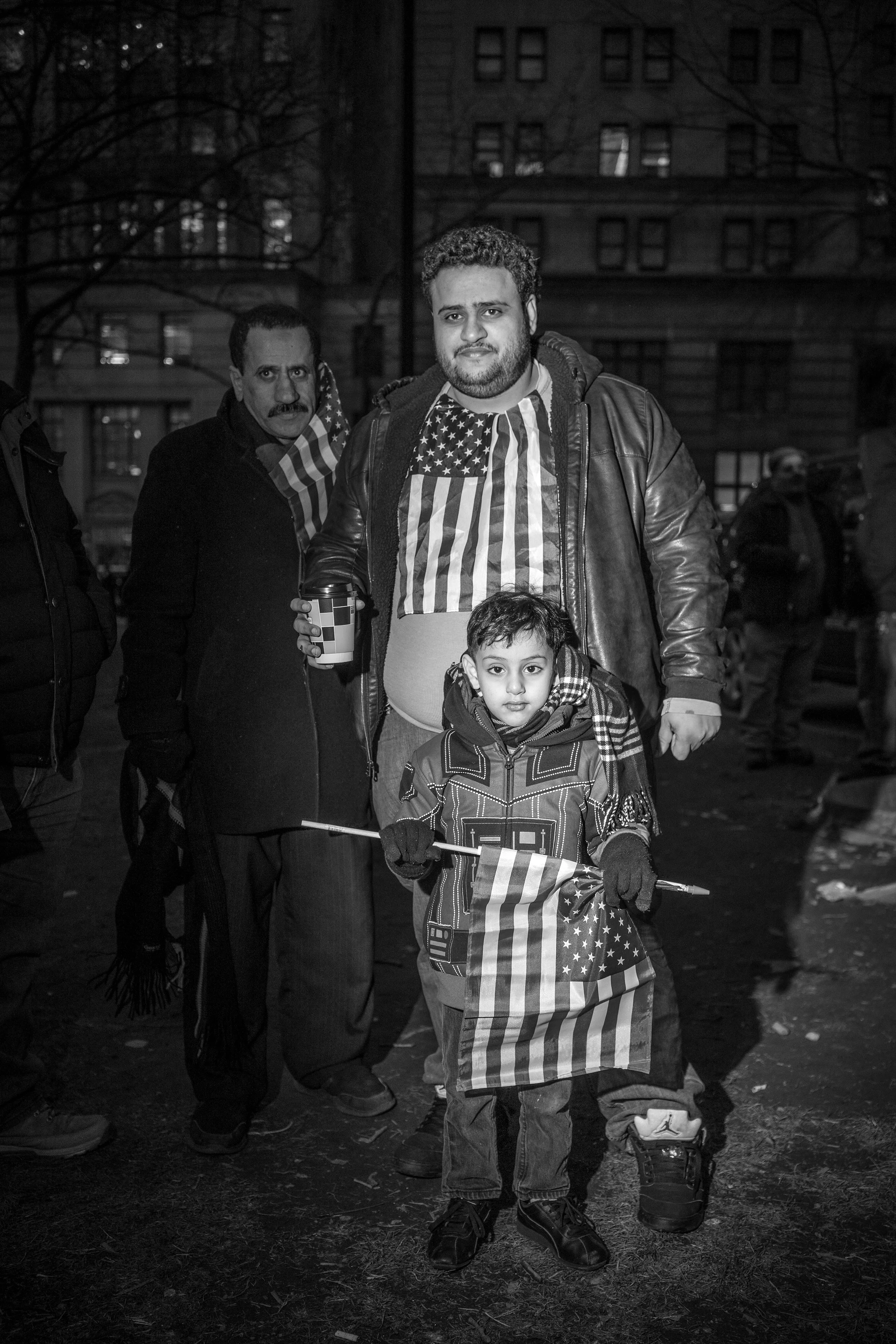 D4 John Trotter New 02_YemeniFamilyWithAmericanFlags.jpg