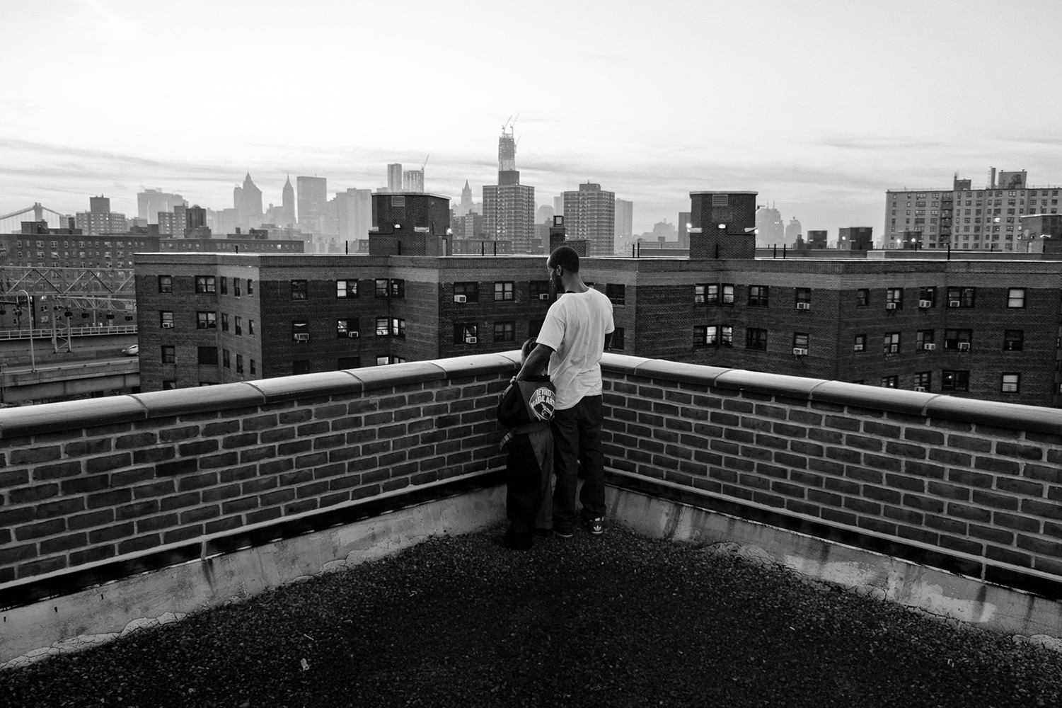  Zun Lee,  Jerell Willis and son Fidel enjoy a fall sunset over downtown New York , New York, NY, 2012 