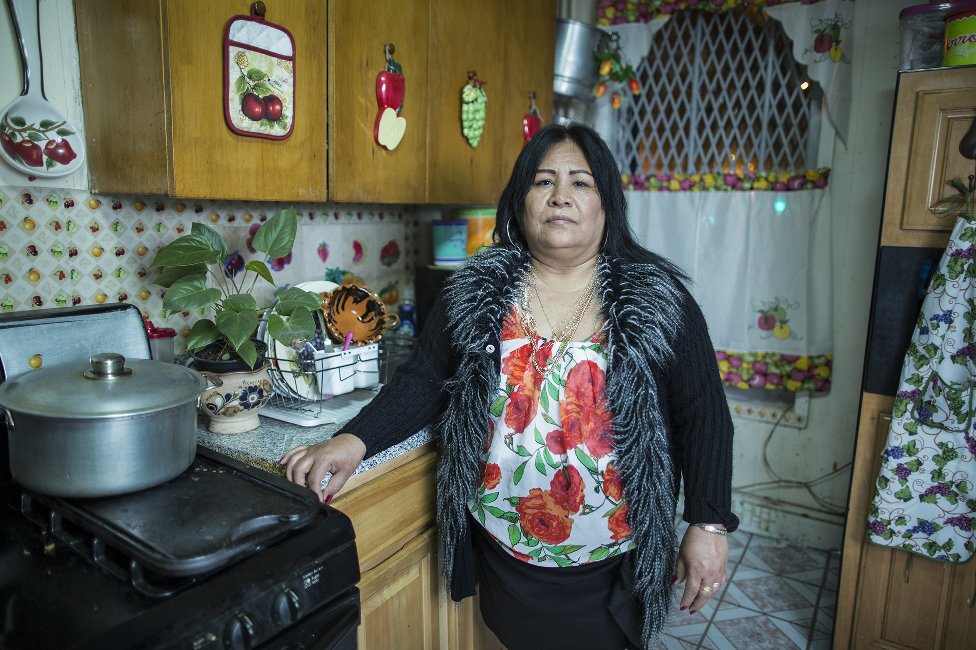 Juanita Torres de León in the kitchen at her home on 59th Street, Sunset Park, Brooklyn. She was born in Atencingo, Puebla, but for 27 years she has lived with her whole nuclear family in Sunset Park. Juanita is a member of Saint Jacobi’s Church and coordinator of the community kitchen. Juanita was part of the team that eventually came to be known as “Occupy Sandy” in 2012, feeding the volunteers who were helping hurricane victims.