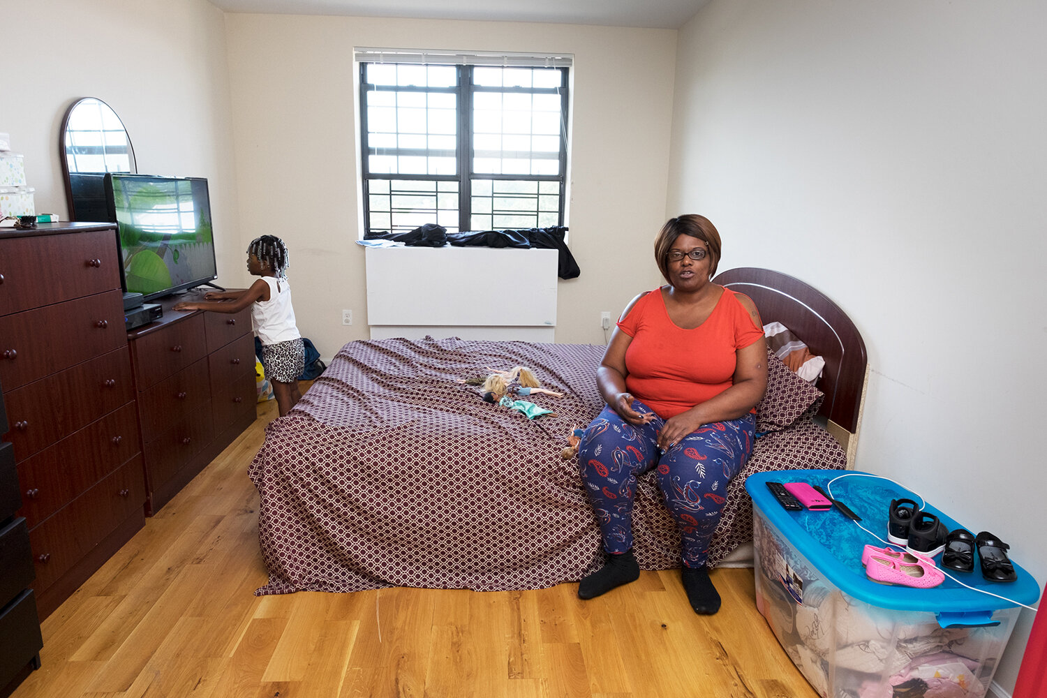  Towanda, 45, in her own apartment five years after her release, with her daughter, Equanni. Bronx, NY, 2017. Image © Sara Bennett. 