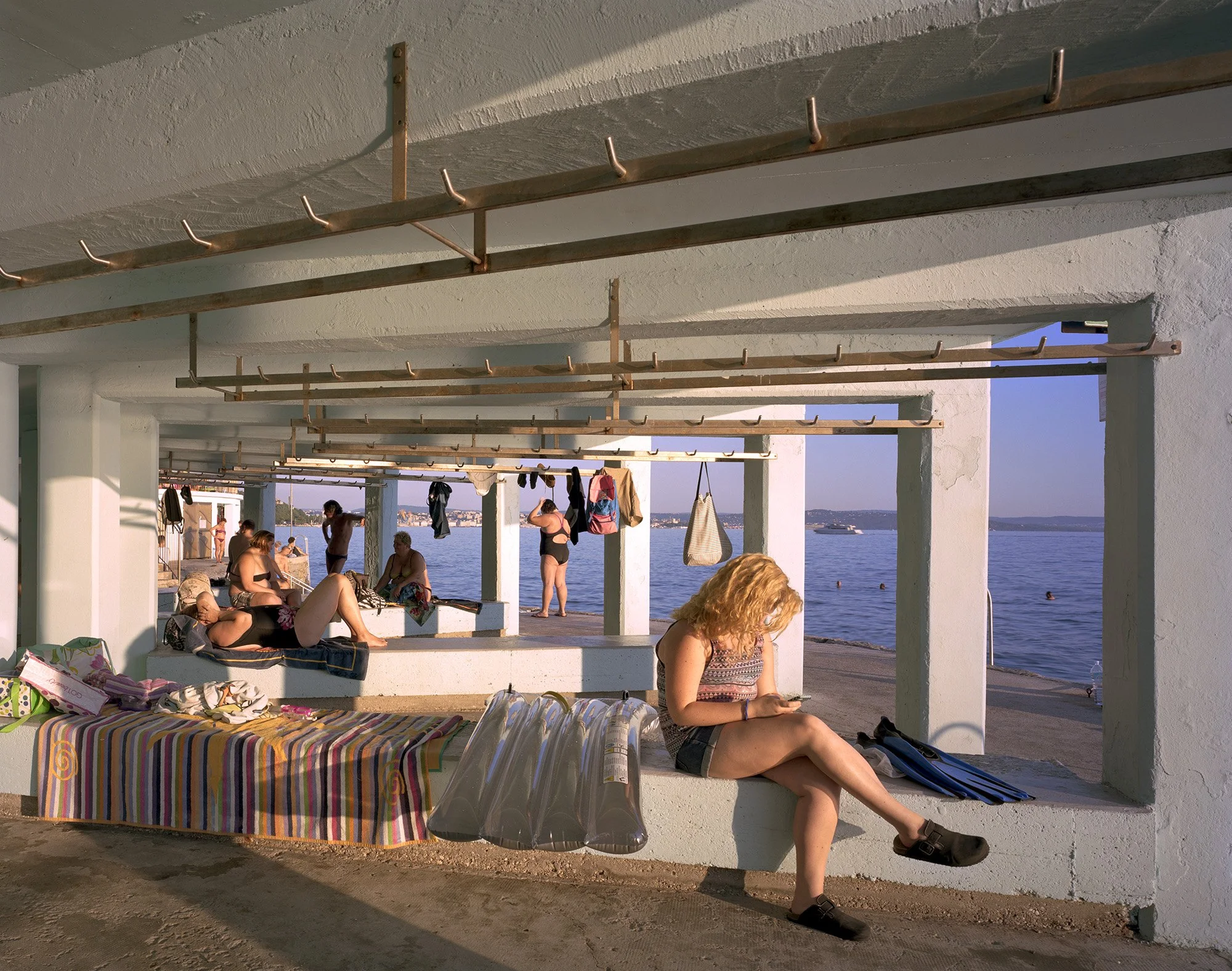     Girl on Phone, Beach Shelter, Trieste, Italy, 2016