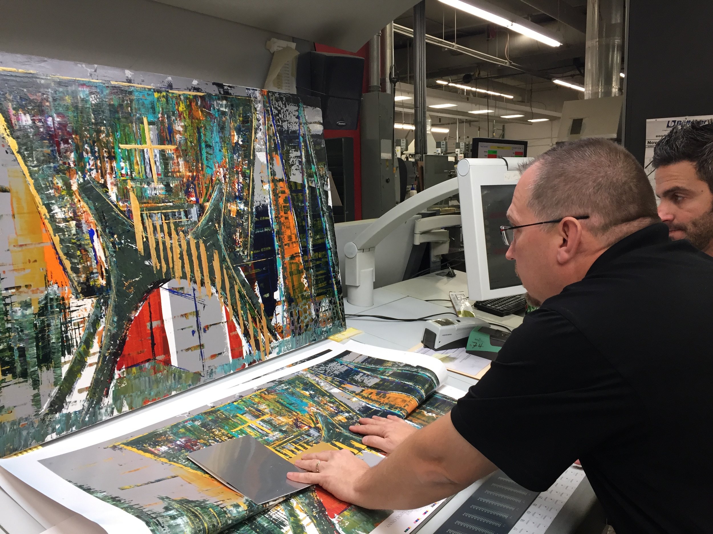 The original is propped into a light box which allows them to get the closest match of color possible. 