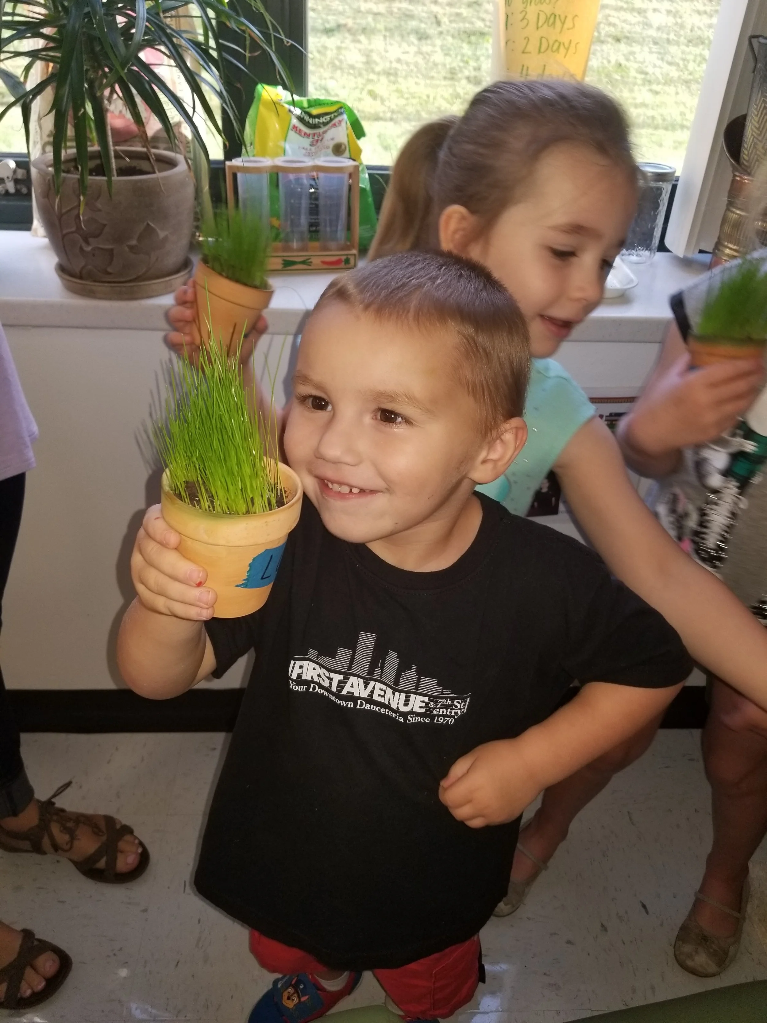 We are growing! Discussing how to care for plants is a life skill full of predictions, experimenting and valuable learning opportunities.