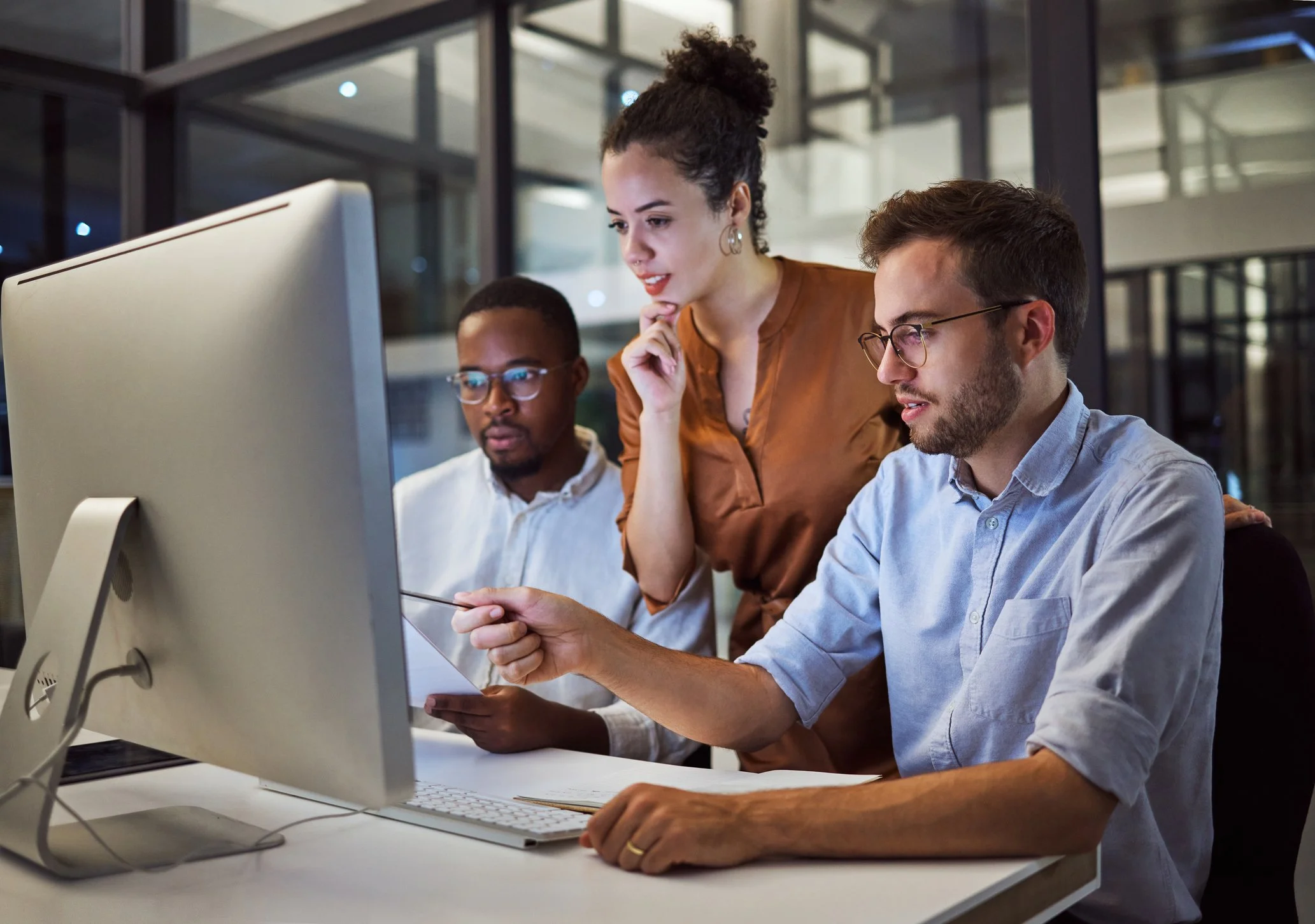 Marketing team reviewing image copyright permissions before using photographs in business content