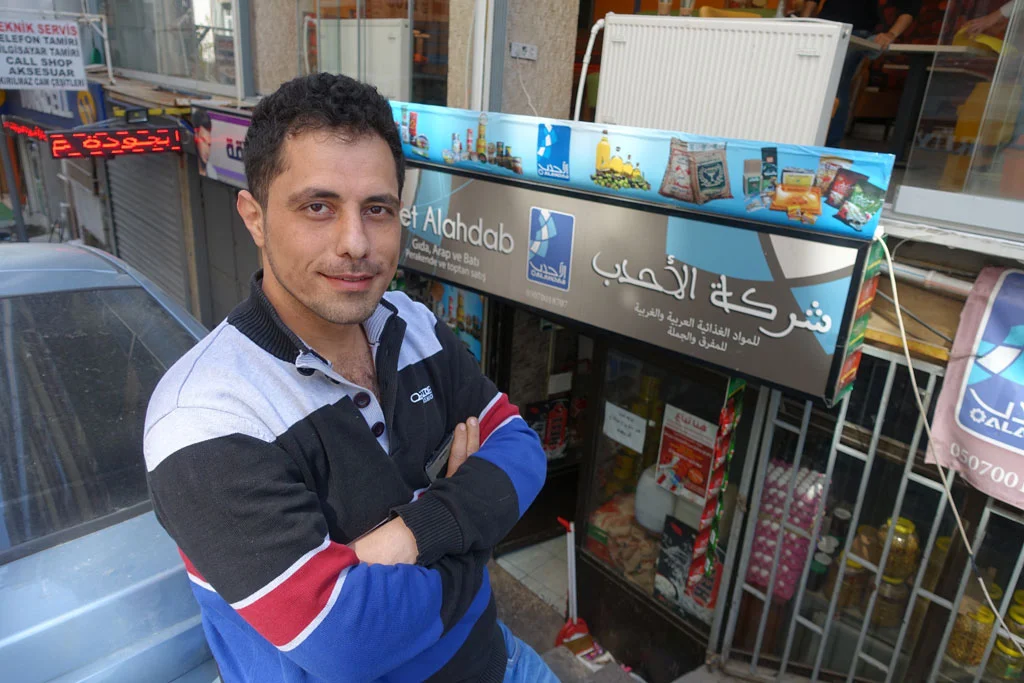 Jihad Al Ahdab stands outside his small Syrian grocery store in the heart of Istanbul's "Little Syria". (Photo by Ansel Mullins)
