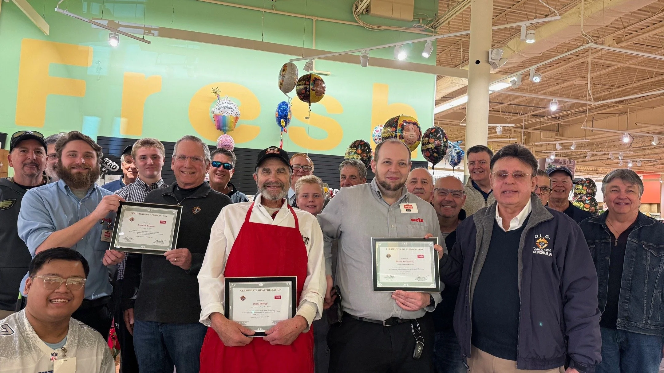 Grand Knight Bill Thanel, Our Lady of Guadalupe, #15590, and James Albert, Food For Families Director, present &ldquo;Certificates of Achievement&rdquo; to Weis&rsquo; Grocery Store Management for their exclusive support of the Knights of Columbus &l