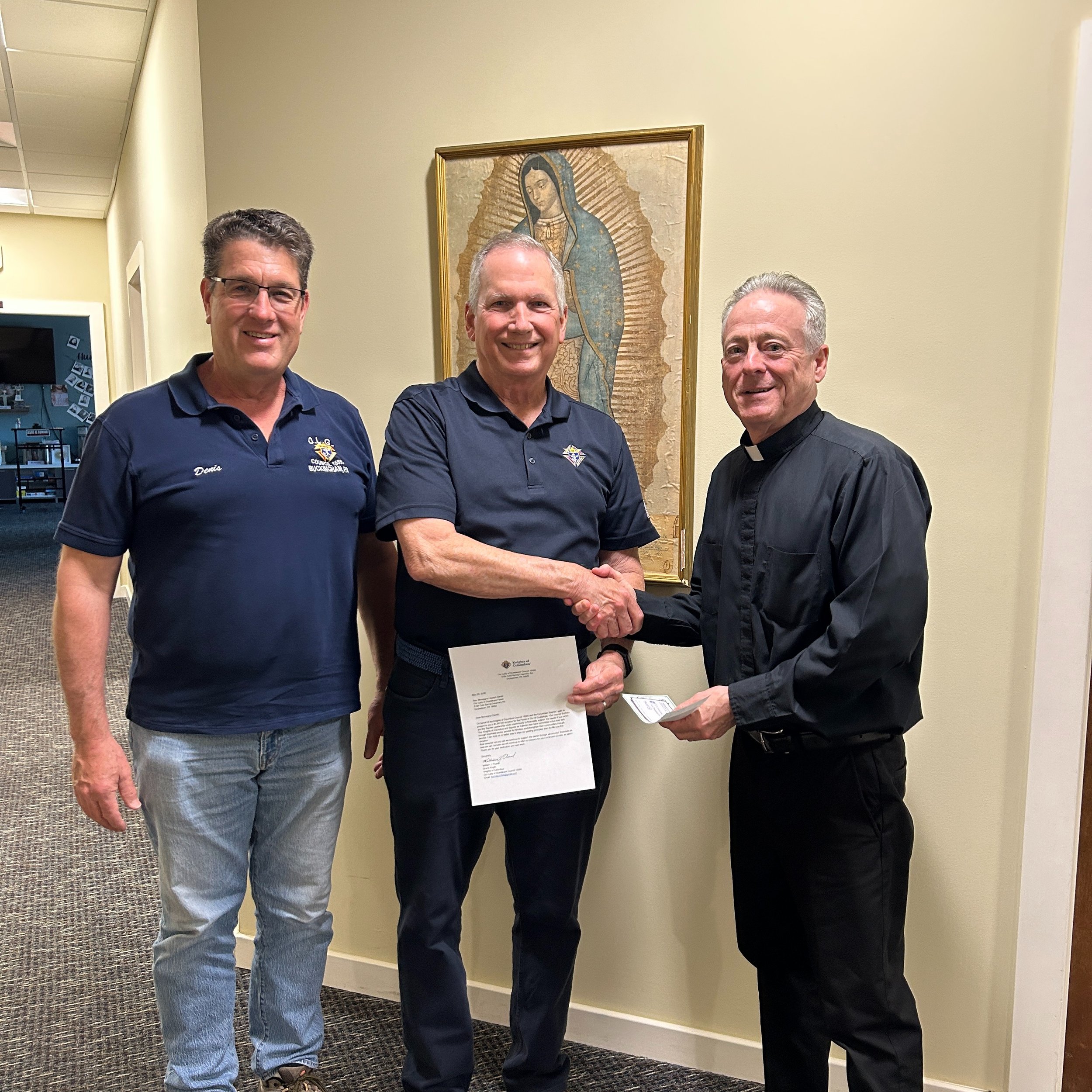 Knights of Columbus Council 15590 makes a donation to Our Lady of Guadalupe Parish