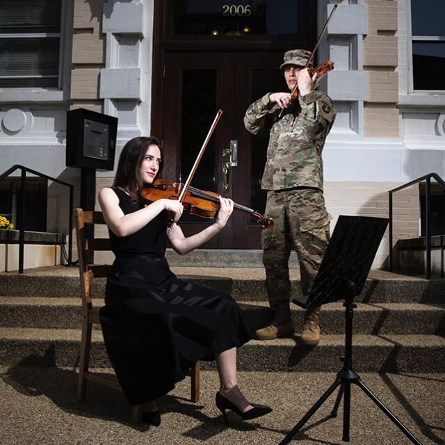 Allyson Goodman, Principal Violist of the Kennedy Center Opera House Orchestra and the
Washington National Opera and her husband Derek Powell, Staff Sergeant, Violinist in the U.S
Army Band &ldquo;Pershing&rsquo;s Own&rdquo;
pose for a photo outside 