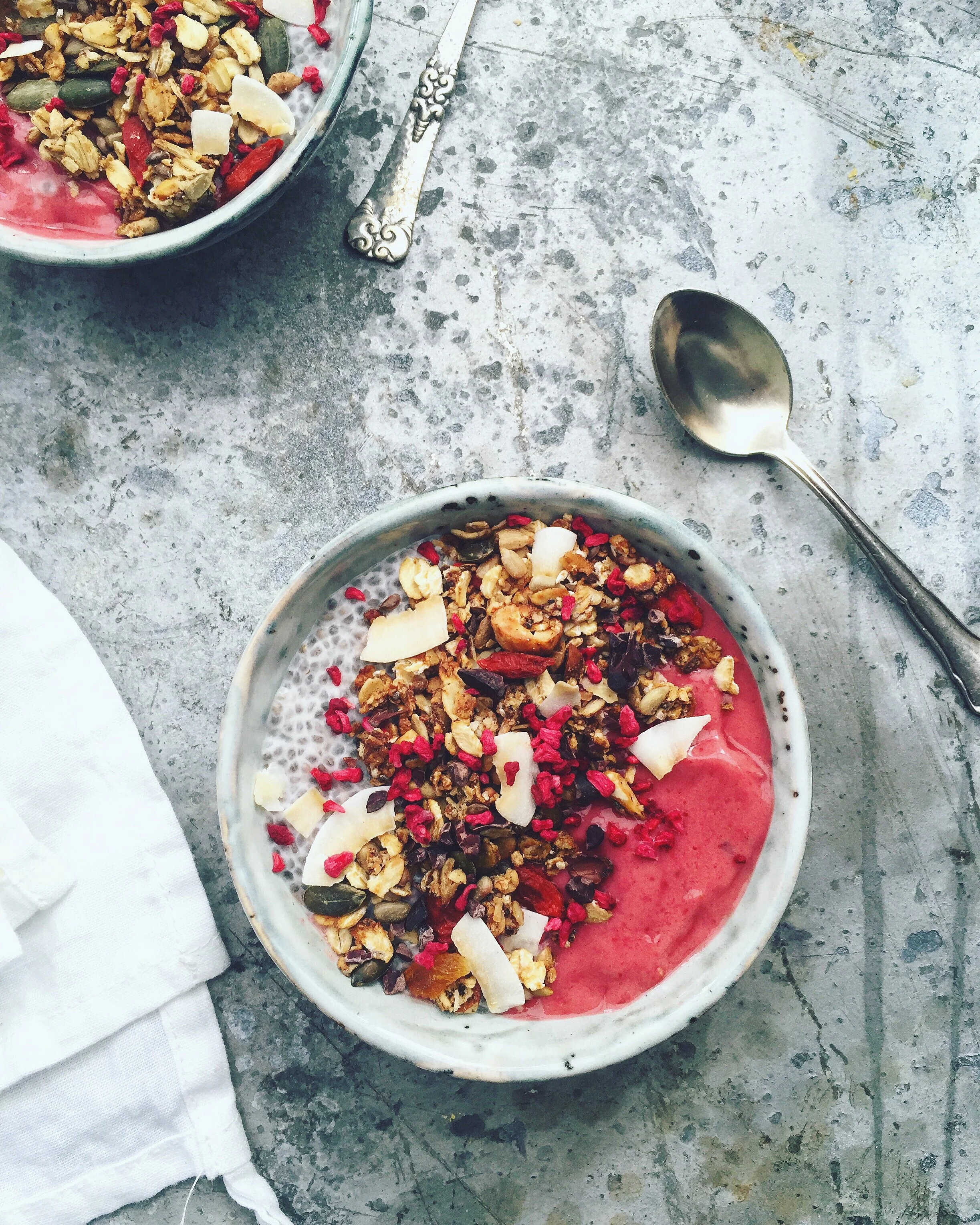 Berry smoothie and coconut chia bowl with granola 