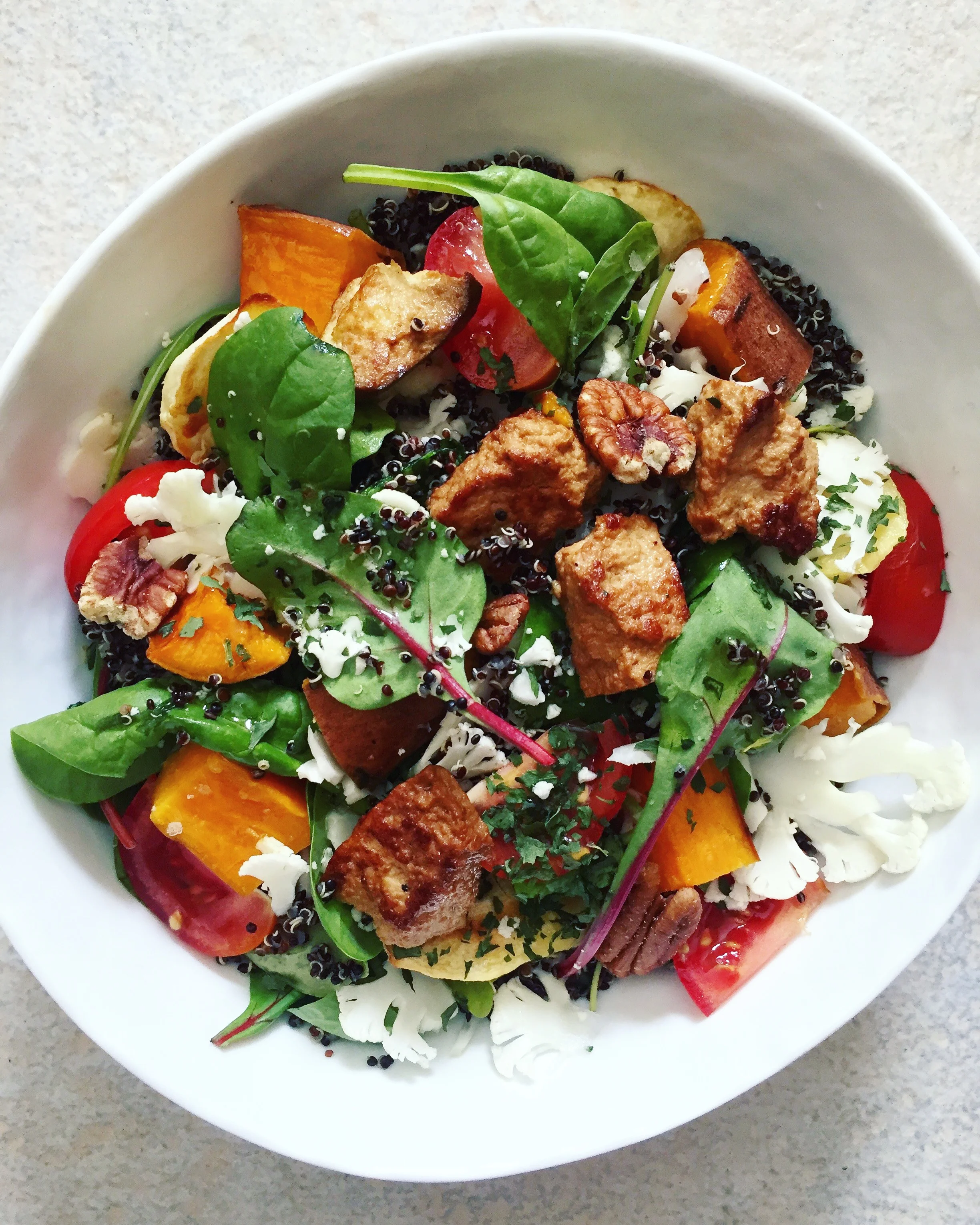 Quinoa and tofu salad with roasted sweet potatoes