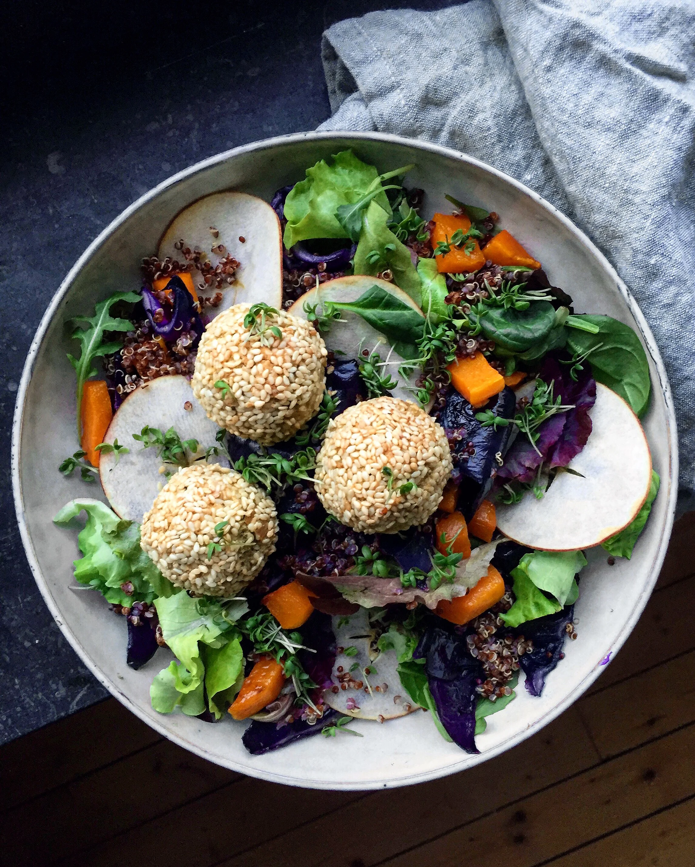Red quinoa and roasted red cabbage salad with butternut squash, apple and herb baked falafels
