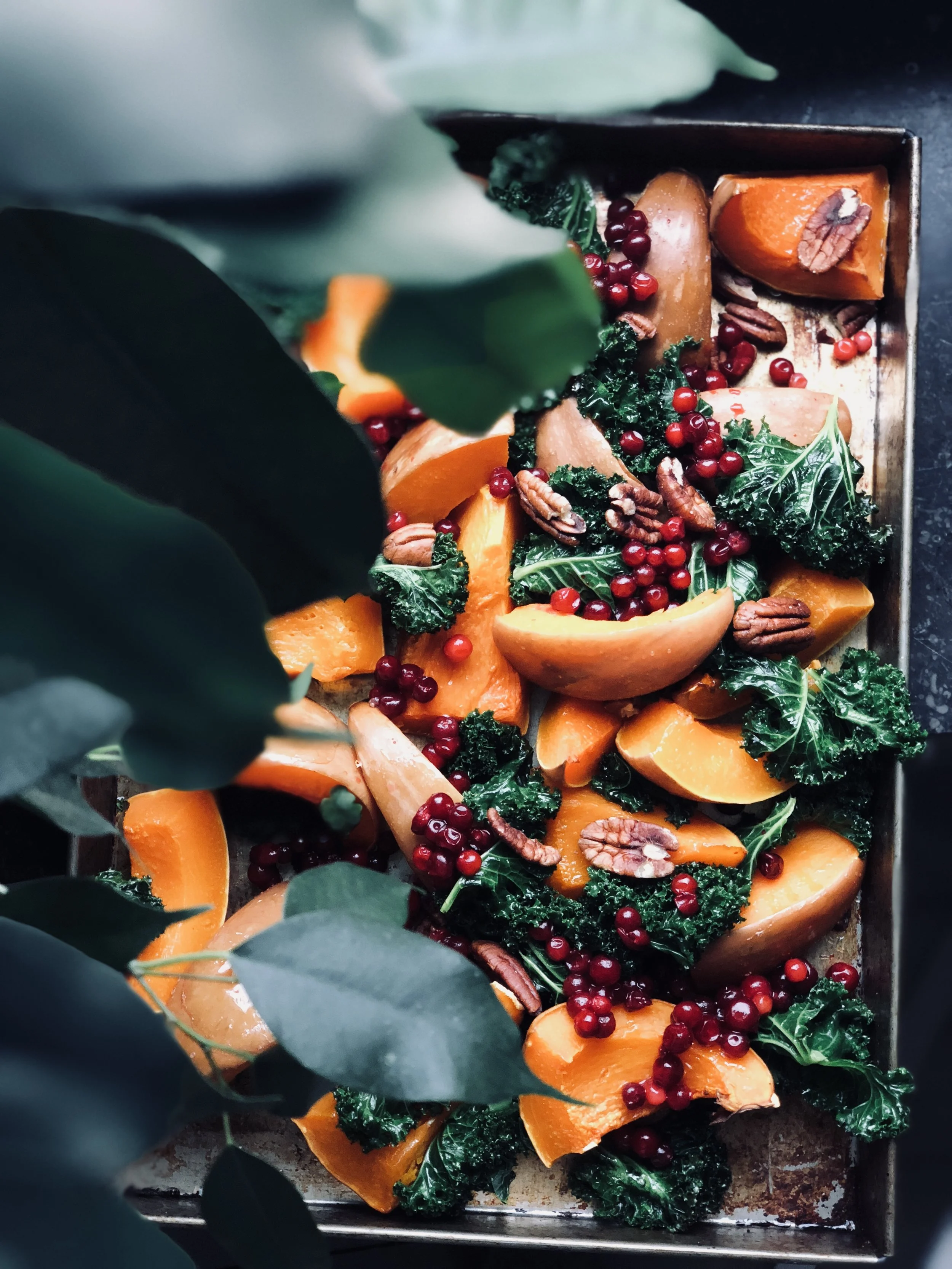 Roasted pumpkin with kale, lingonberries, dijon dressing and pecans
