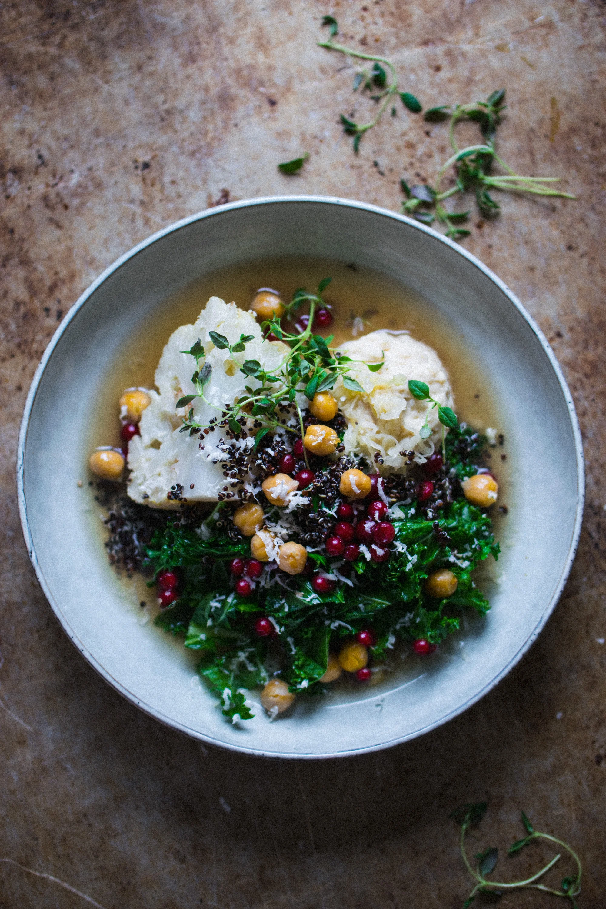 Apple baked cauliflower with sauerkraut hummus and stir fried kale salad with quinoa