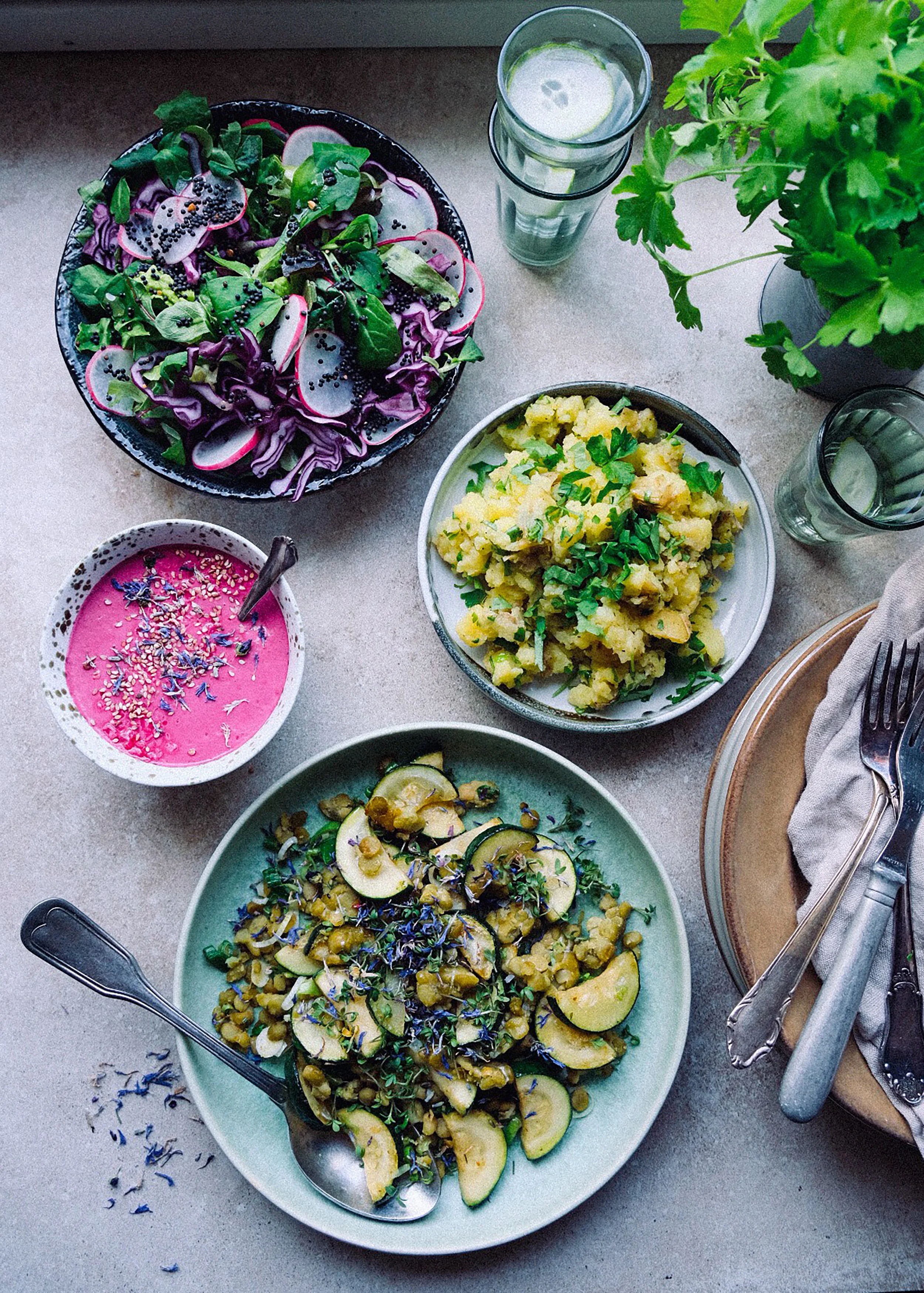 Herby potato mash with green pea tempeh and courgette stir fry, tahini beet dressing and crispy salad