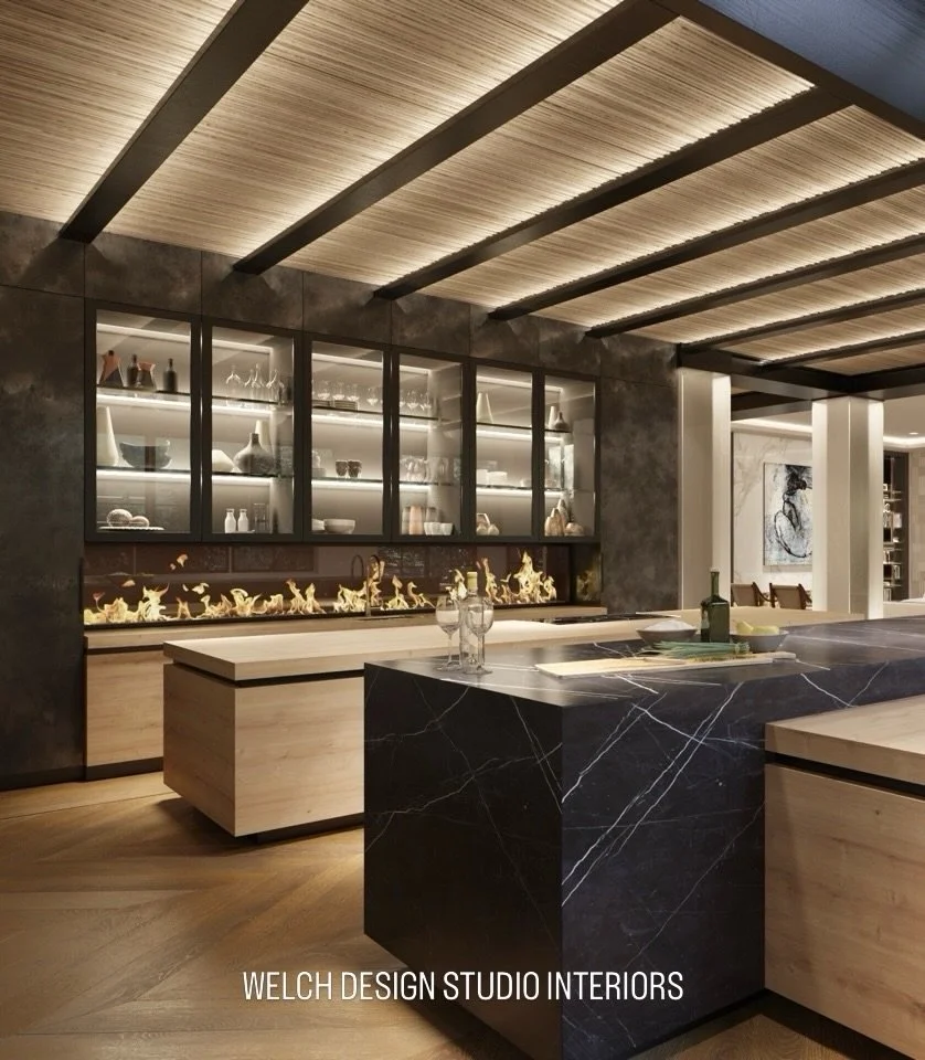 A warm modern kitchen we designed in Newport Beach.
We love the mix of wood, black stone, soft lighting, and the long fireplace wall.

Welch Design Studio
Welch Design Studio Interiors
@welchinteriors @welch_design_studio