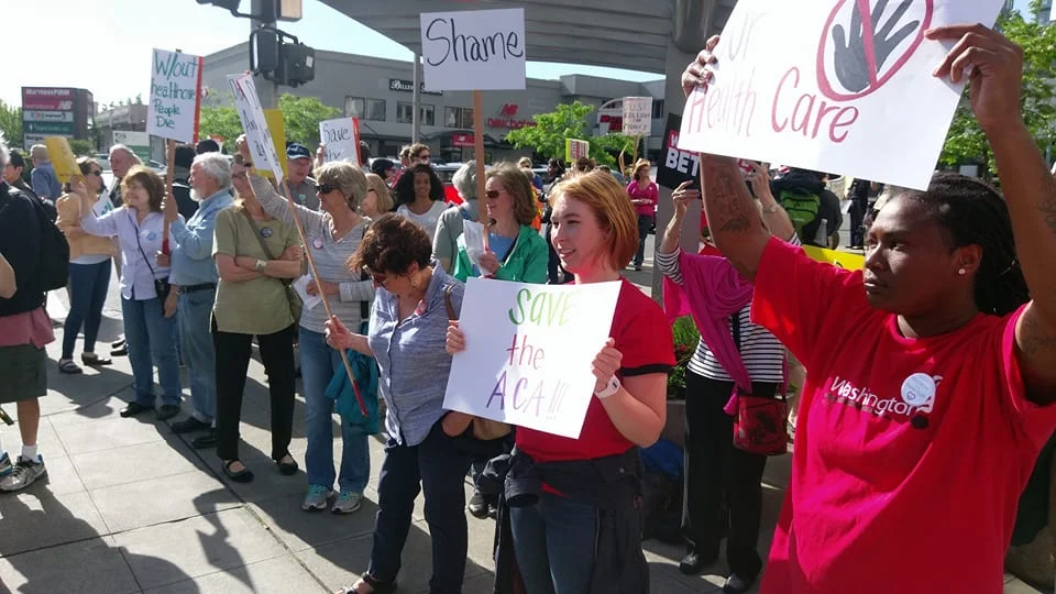 Protesting Rep. McMorris-Rodgers support for ACA repeal outside of a Microsoft PAC Fundraiser she attended. 
