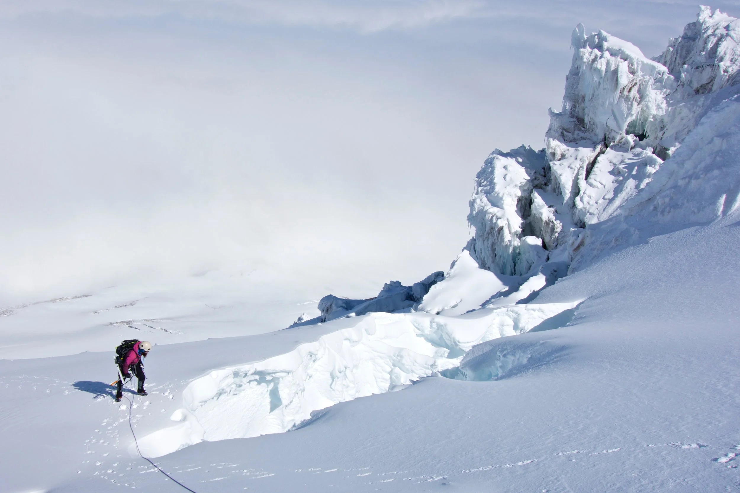 Kelsey, checking out a large crevasse with a thin bridge