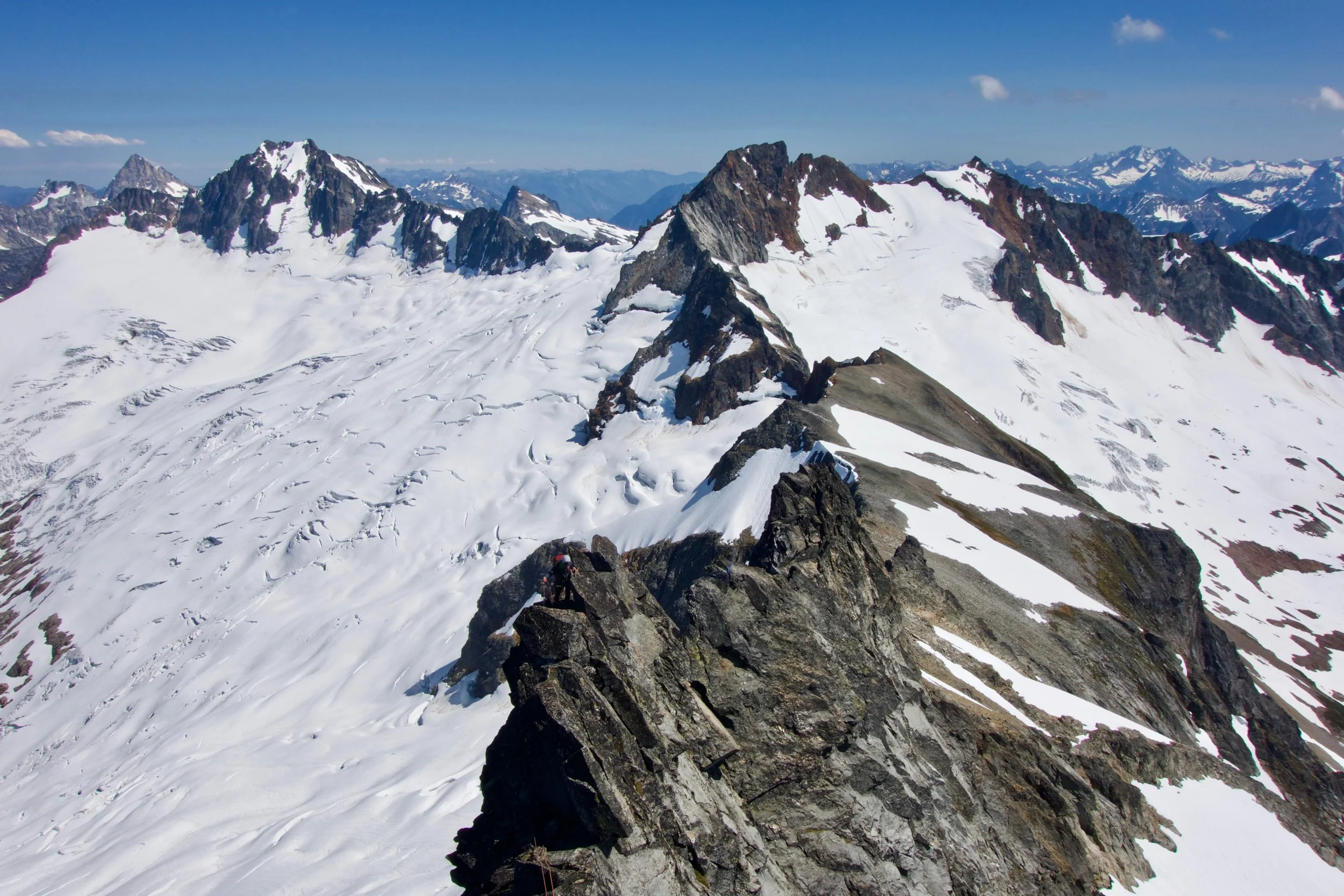 Exposure on the East Ridge with views of Buckner, Boston, and Sahale