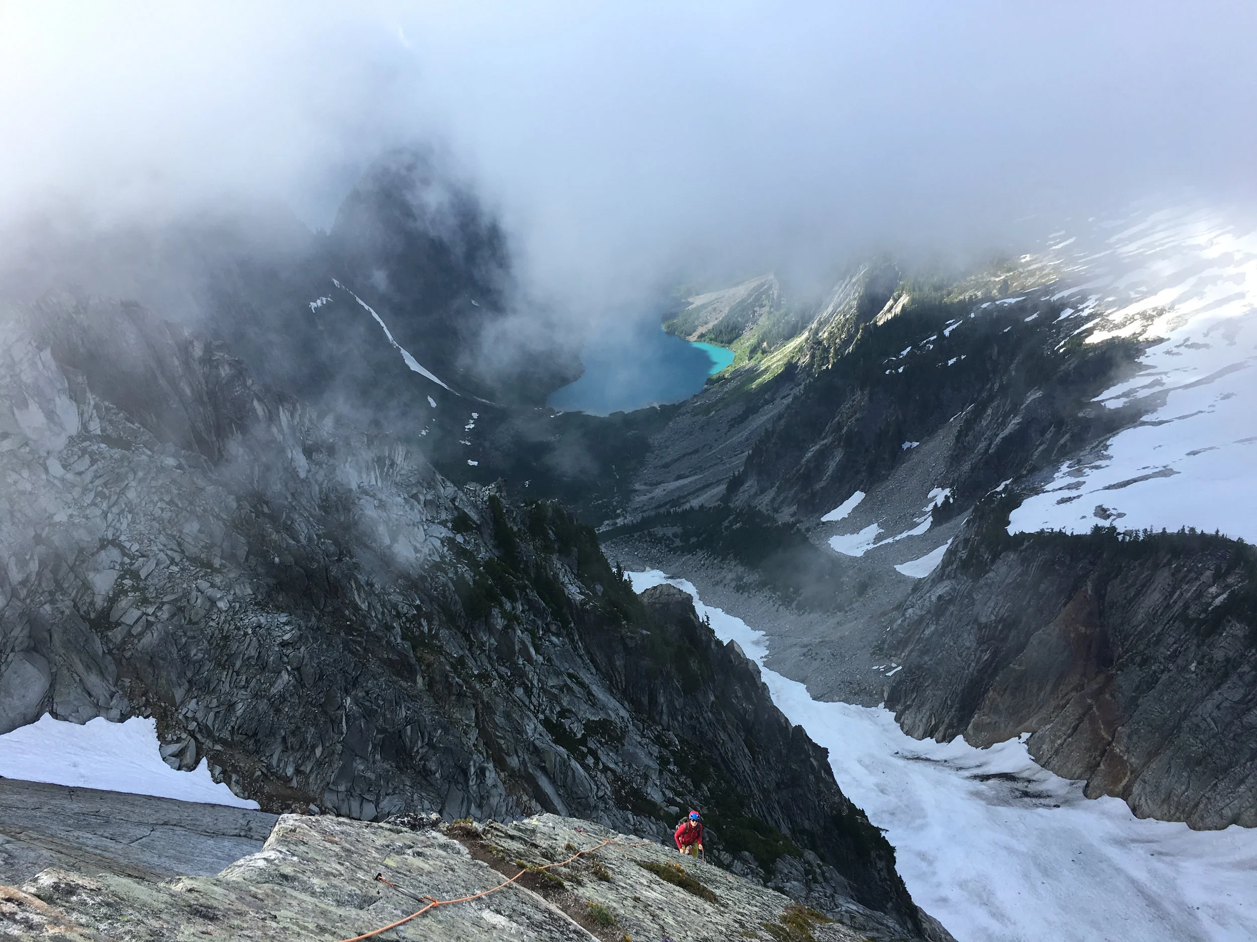 Looking down at the final belay as the clouds closed in on us again