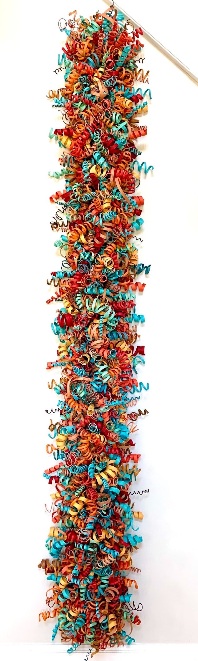 Colorful abstract wood sculpture by Karmin Schafer