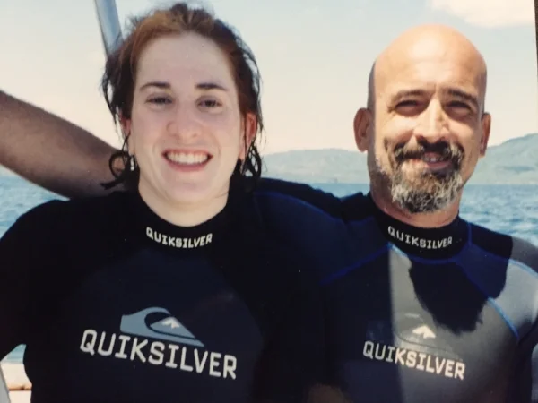 On the boat with my dive master. I was such a wimp I held this poor guy's hand the entire dive. We swam by a bunch of sharks, maybe 20 yards away? And saw GORGEOUS fish. 