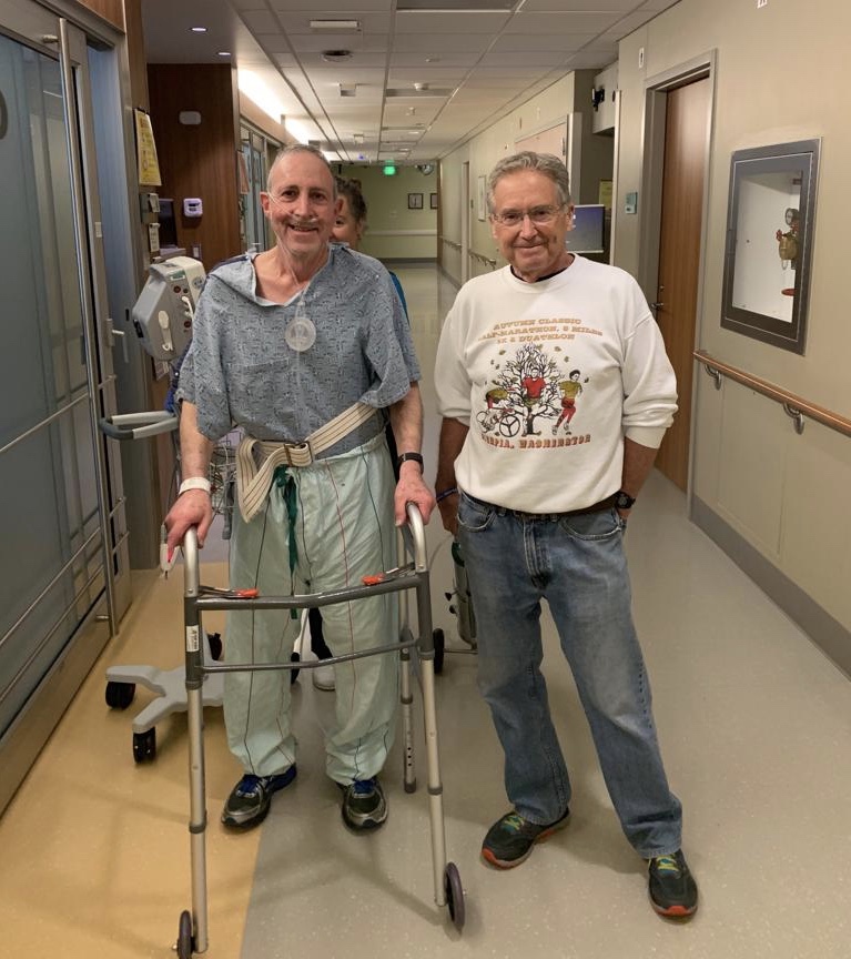 My dad walking with a friend in the hospital. He’s on oxygen 24/7 and has to use the walker at home too.