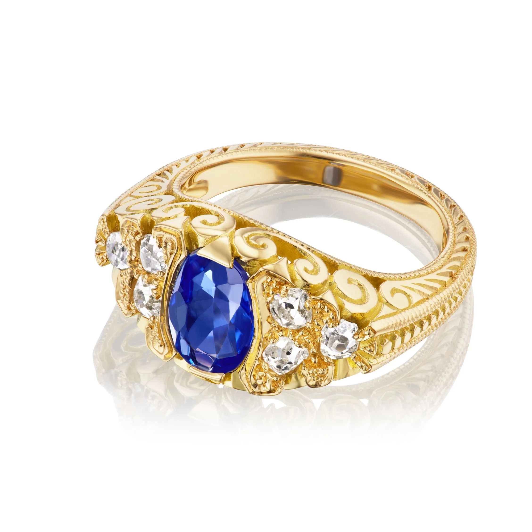 1.55 ct unheated Kashmir/Ceylon sapphire ring in 18K gold with diamond accents.