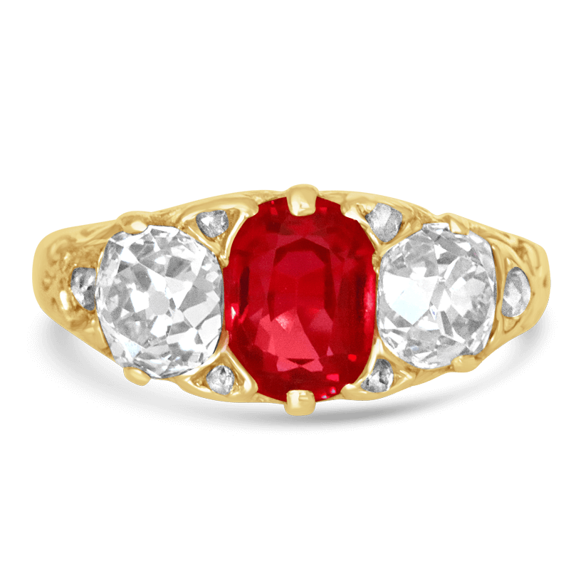 Gold ring with ruby in center with a diamond one each side