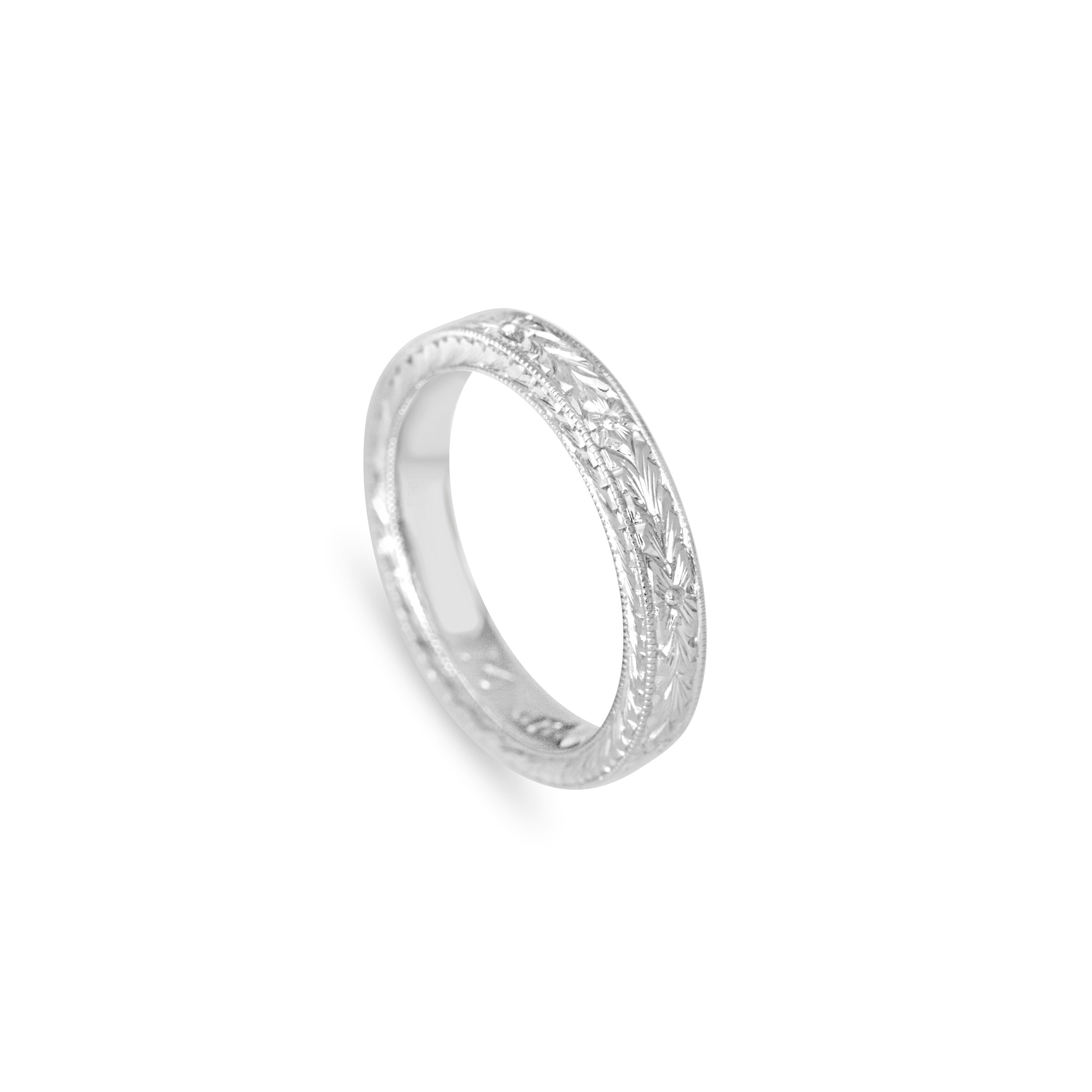 Hand engraved platinum wedding band.jpg