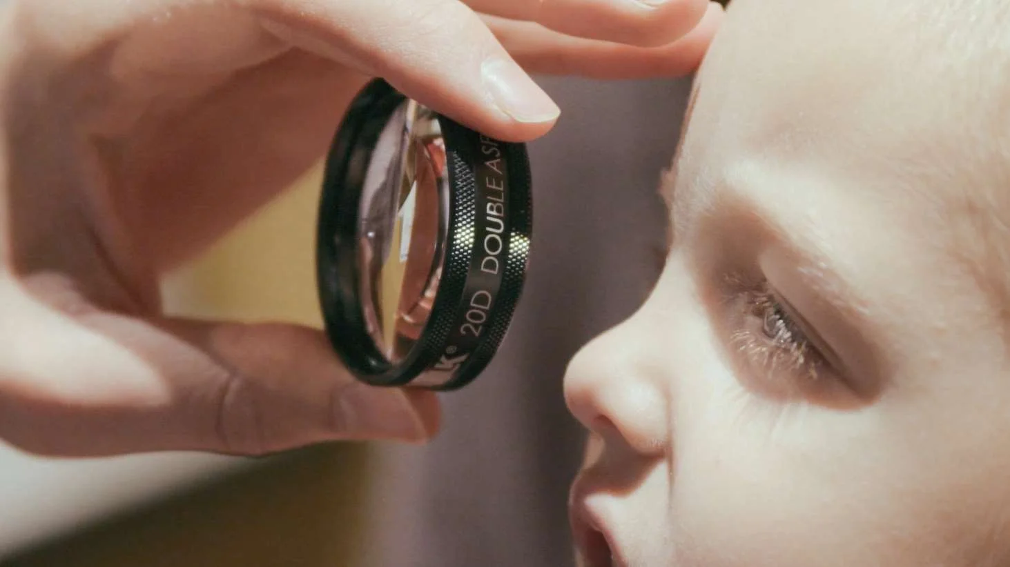 Close up child with lens.jpg