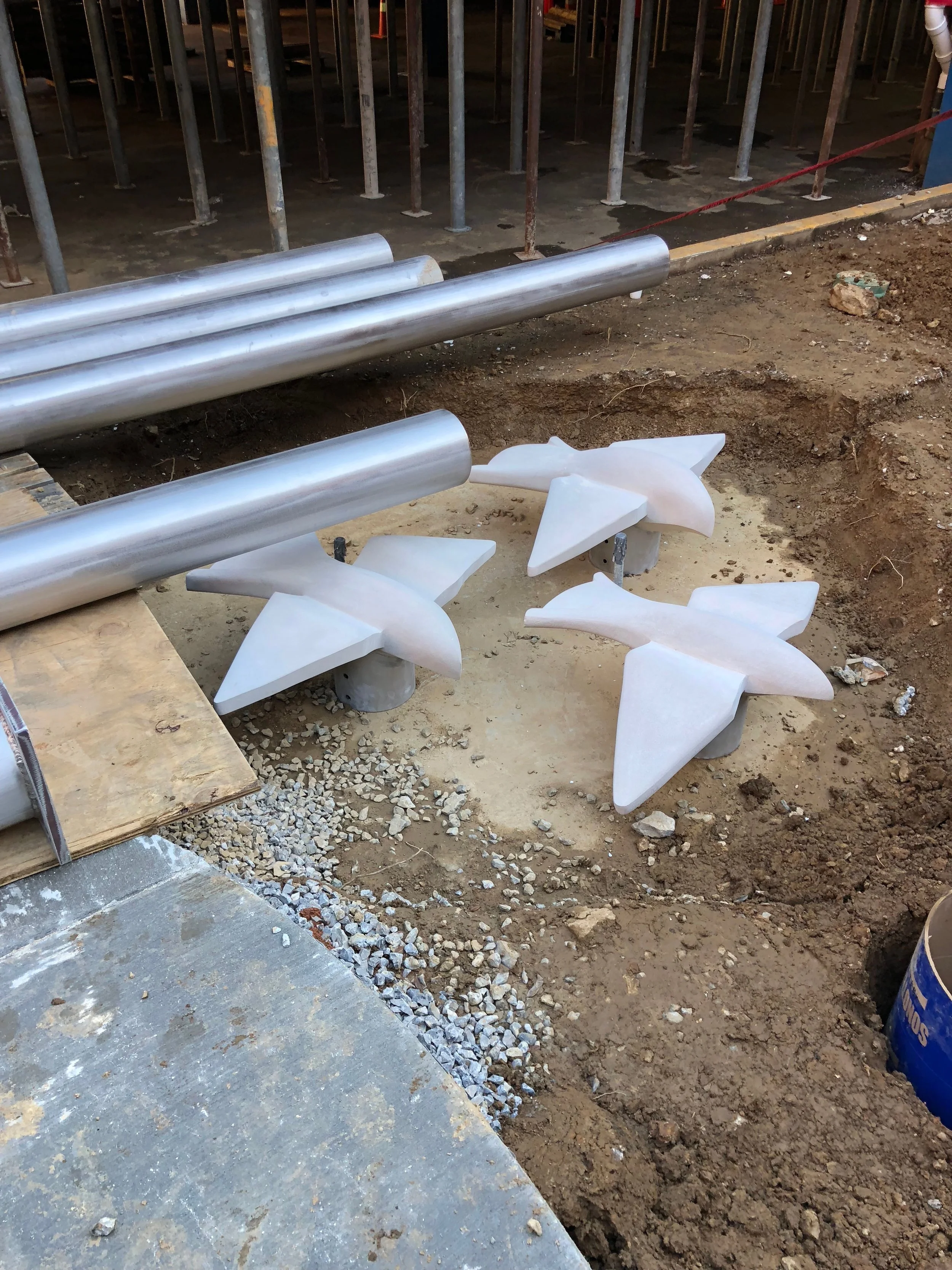 Birds and poles waiting to be installed