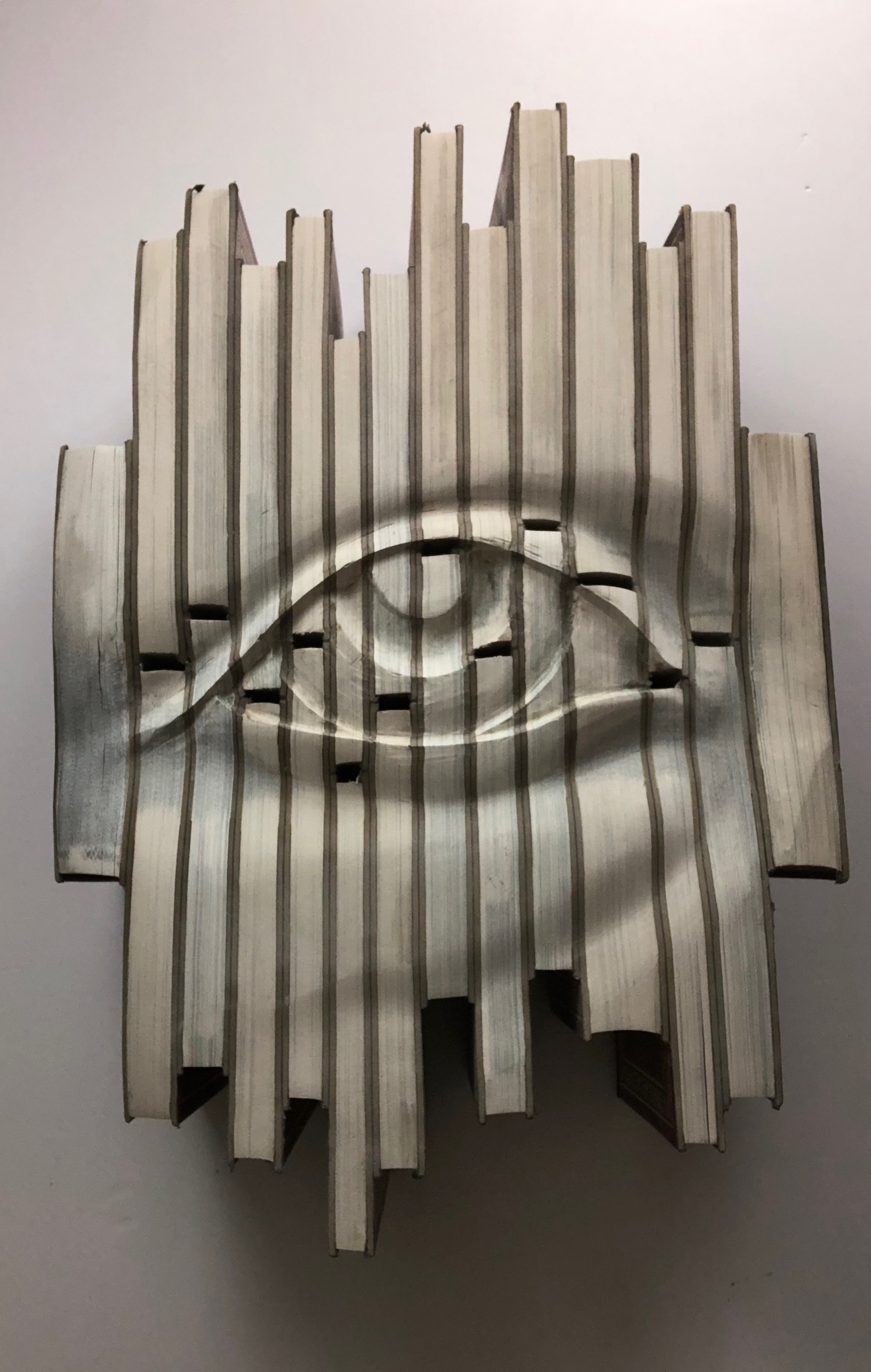 "Minds Eye", a Sculpture Carved From Old Encyclopedias by Mike McCarthy