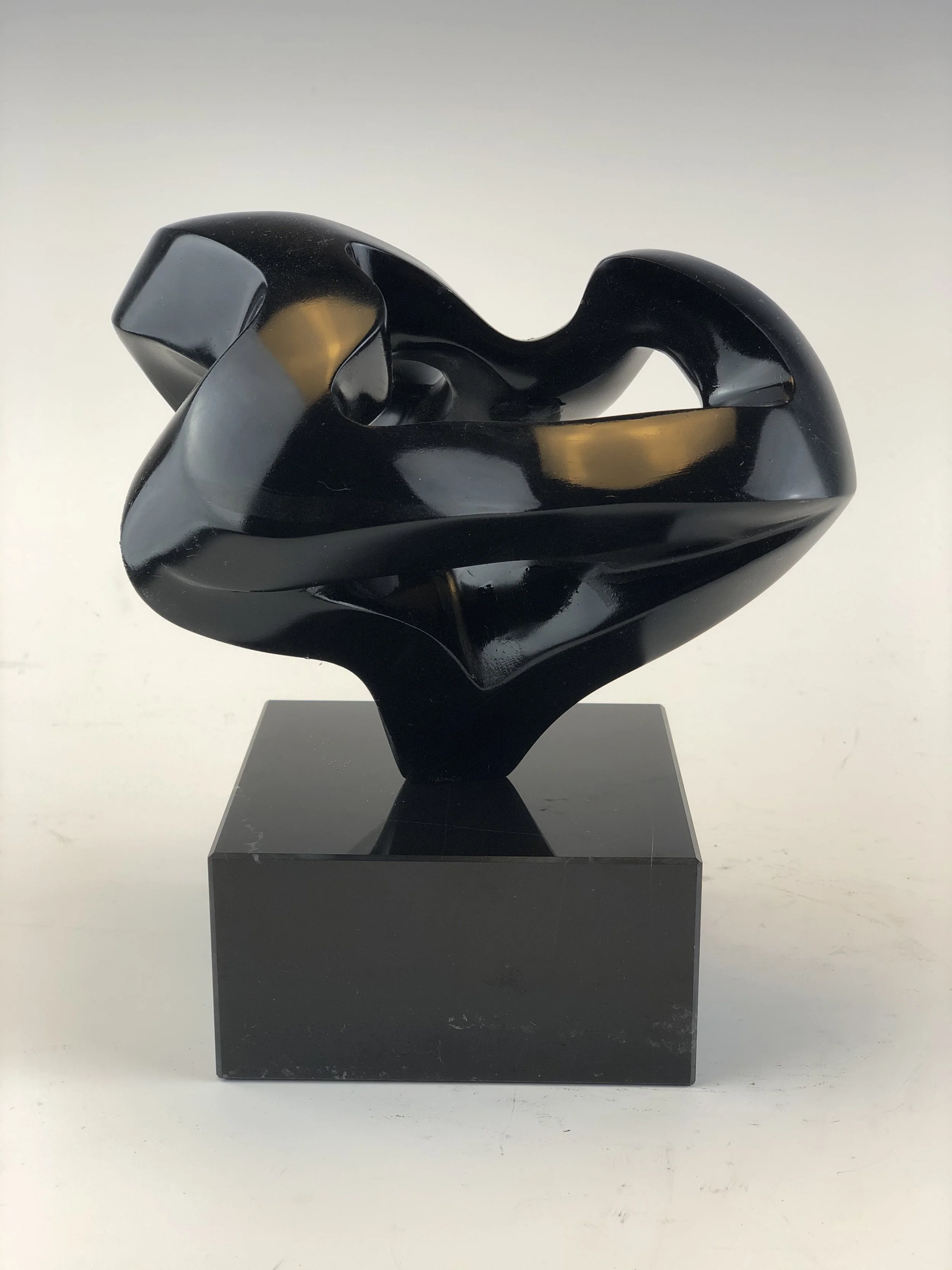 Winter Rose is a contemporary black soapstone sculpture that twists in on itself.