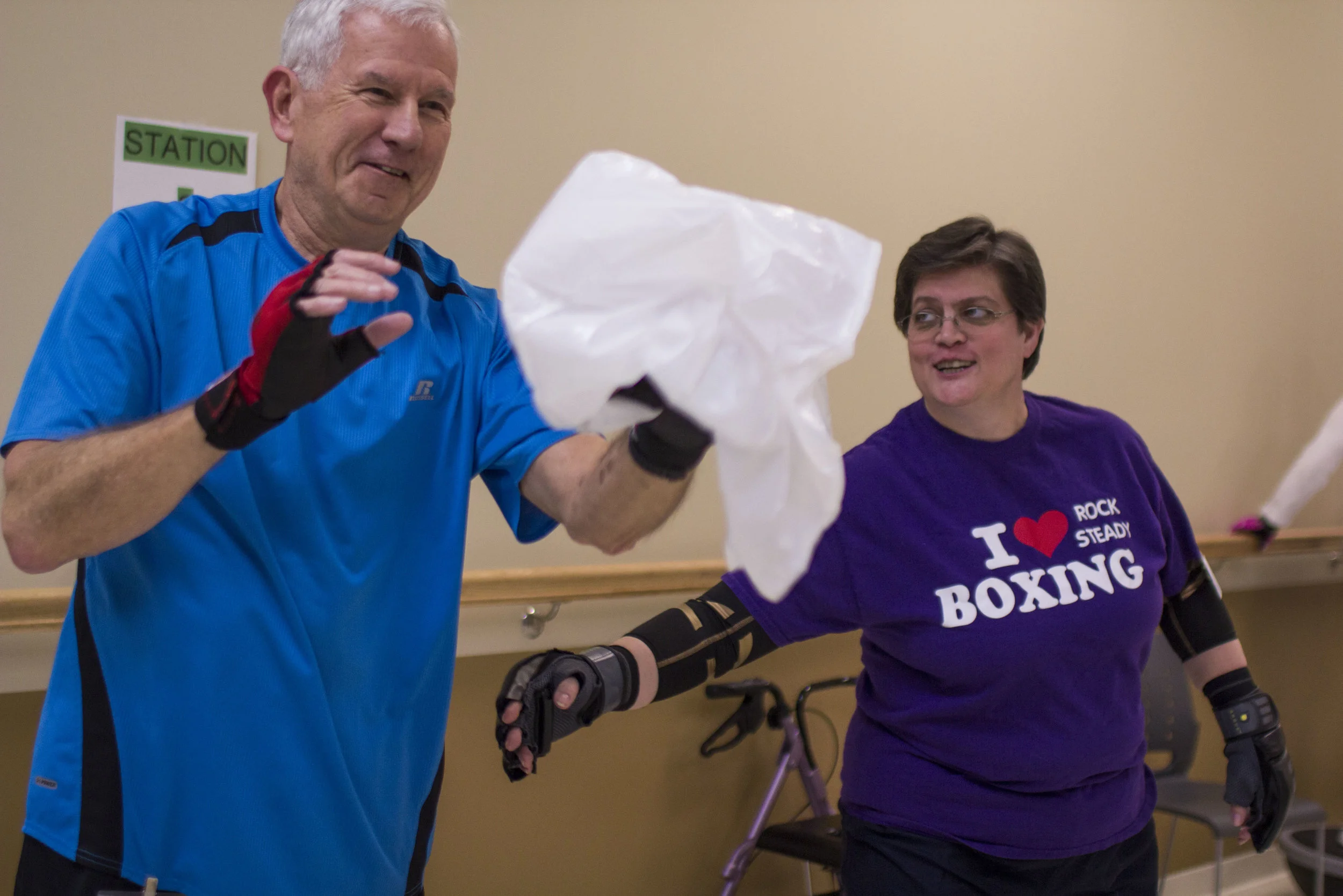  Joe Light does a punching exercise with a plastic bag as Jill Jeffey pokes his side as a joke. Light caught his Parkinson's early on and is still able to work full-time in education. "While they're looking for a cure," Jeffey said," we can do someth