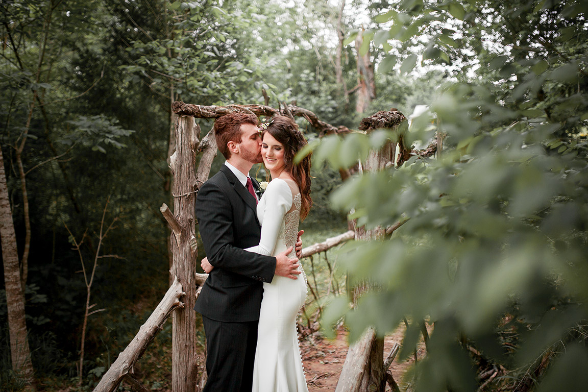 The couple at a bridge located on one of our Hiking Trails.