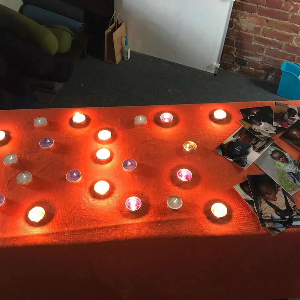 Candles and photos at the Circle of Remembrance