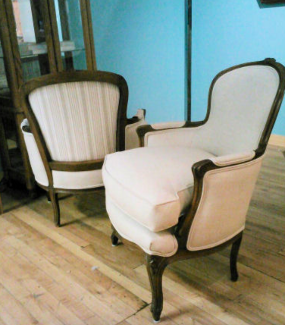 This beautiful pair of chairs belonged to the client's Grandmother-in-law. After searching for something suitably small, she and her husband decided to look into reupholstery as an option. The frames were cleaned and re-glued, but we kept the original down seat cushions and selected a simple linen by Greenhouse to show off the shape of the chairs. A little striped fabric provided just a touch of fun in the back!