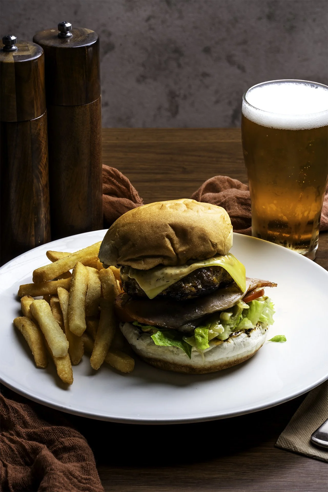 Beef Hamburger with chips and a beer