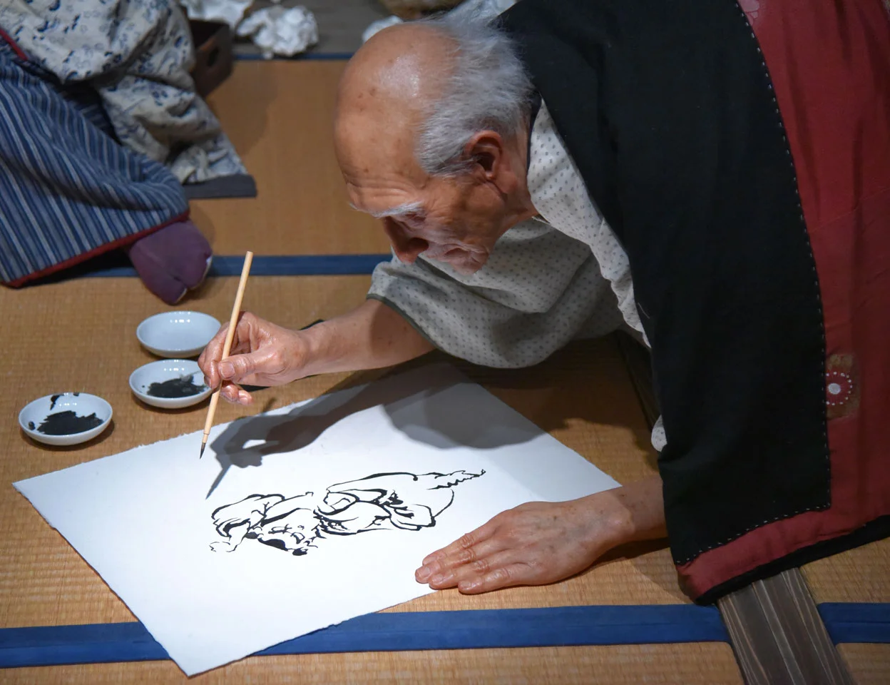Life-size diorama of Hokusai working in his home